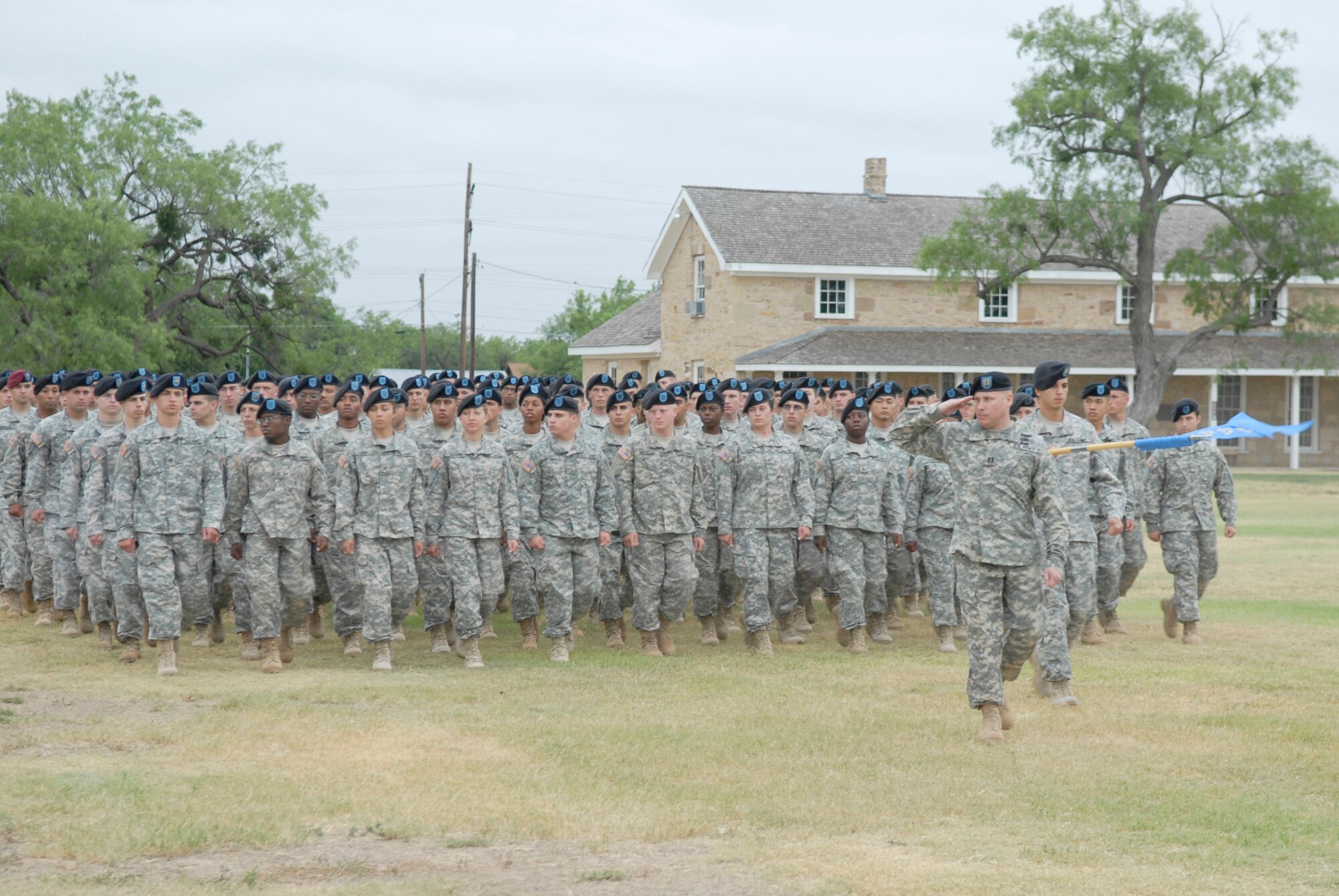 SAN ANGELO, Texas -- Soldiers from the 344th Military Intelligence Battalion perform a pass and review during the change of command ceremony, June 15, 2010. The 344th MIBN is a tenant command located on Goodfellow Air Force Base. The ceremony took place at Fort Concho National Historic Landmark. (U.S. Air Force photo/Lou Czarnecki)
