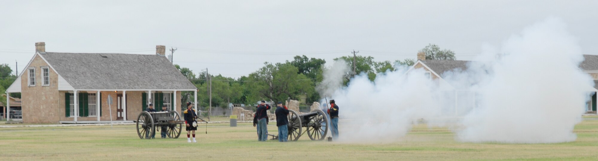 SAN ANGELO, Texas -- Canon fire opens the 344th Military Intelligence Battalion change of command ceremony, June 15, 2010. The ceremony took place at Fort Concho National Historic Landmark. The 344th MIBN is a tenant command located on Goodfellow Air Force Base. (U.S. Air Force photo/Lou Czarnecki)
