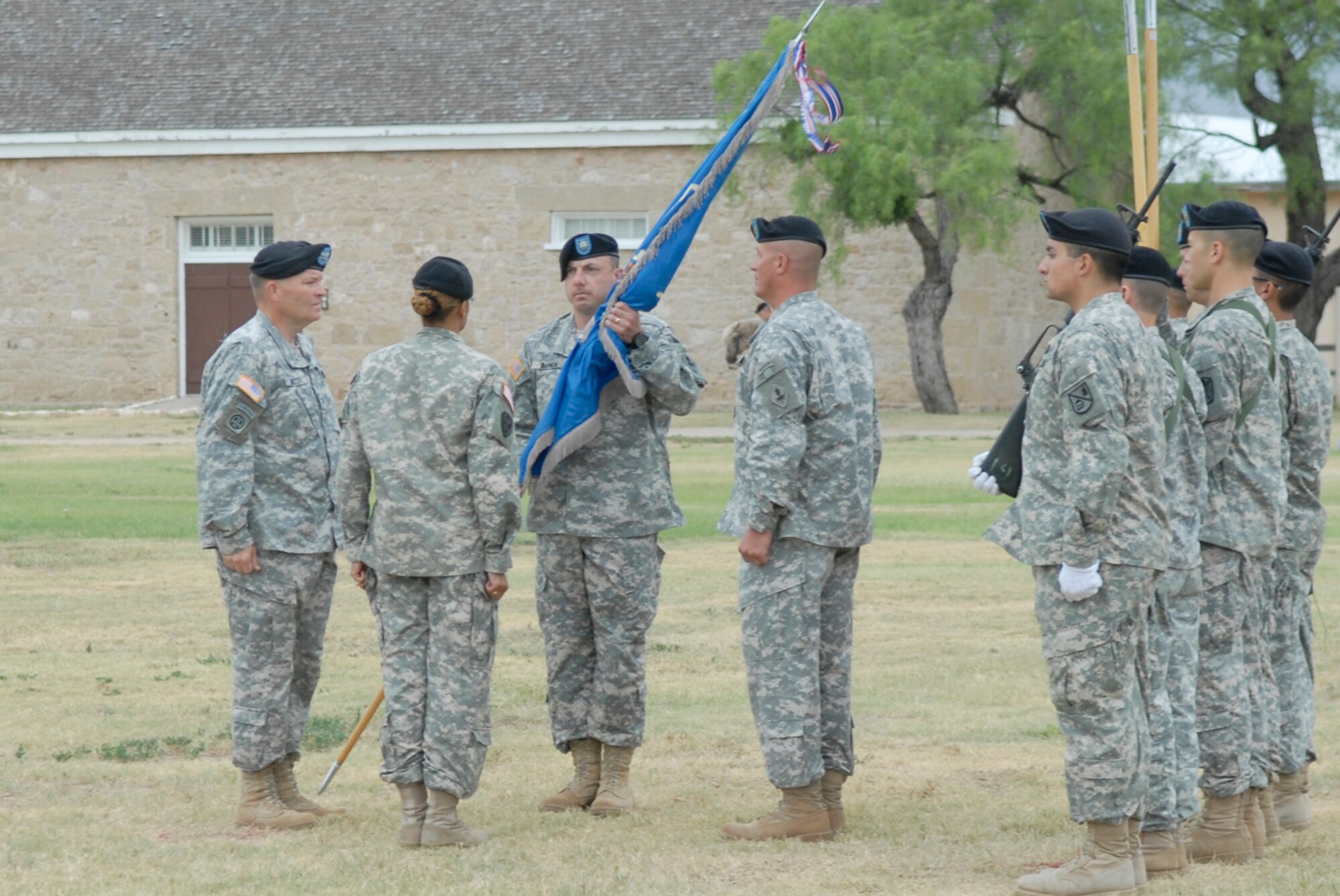 SAN ANGELO, Texas -- Army Lt. Col. John Bonin accepts the battalion colors from Col. Thomas Miller during the 344th Military Intelligence Battalion change of command ceremony, June 15, 2010. Colonel Miller is the commander of the 111th Military Intelligence Brigade, Fort Huachuca, Arizona. The 344th MIBN is a tenant command located on Goodfellow Air Force Base. The ceremony took place at Fort Concho National Historic Landmark. (U.S. Air Force photo/Lou Czarnecki)
