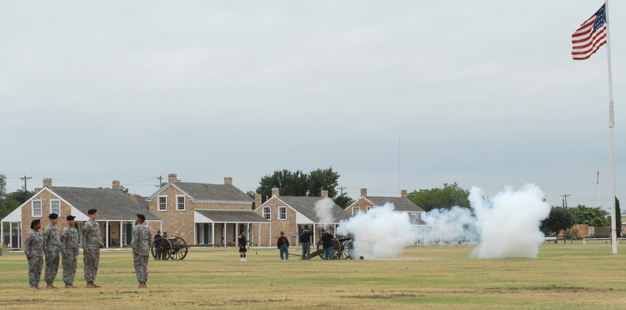 SAN ANGELO, Texas -- Canon fire opens the 344th Military Intelligence Battalion change of command ceremony, June 15, 2010. The ceremony took place at Fort Concho National Historic Landmark. The 344th MIBN is a tenant command located on Goodfellow Air Force Base. (U.S. Air Force photo/Staff Sgt. Laura R. McFarlane)
