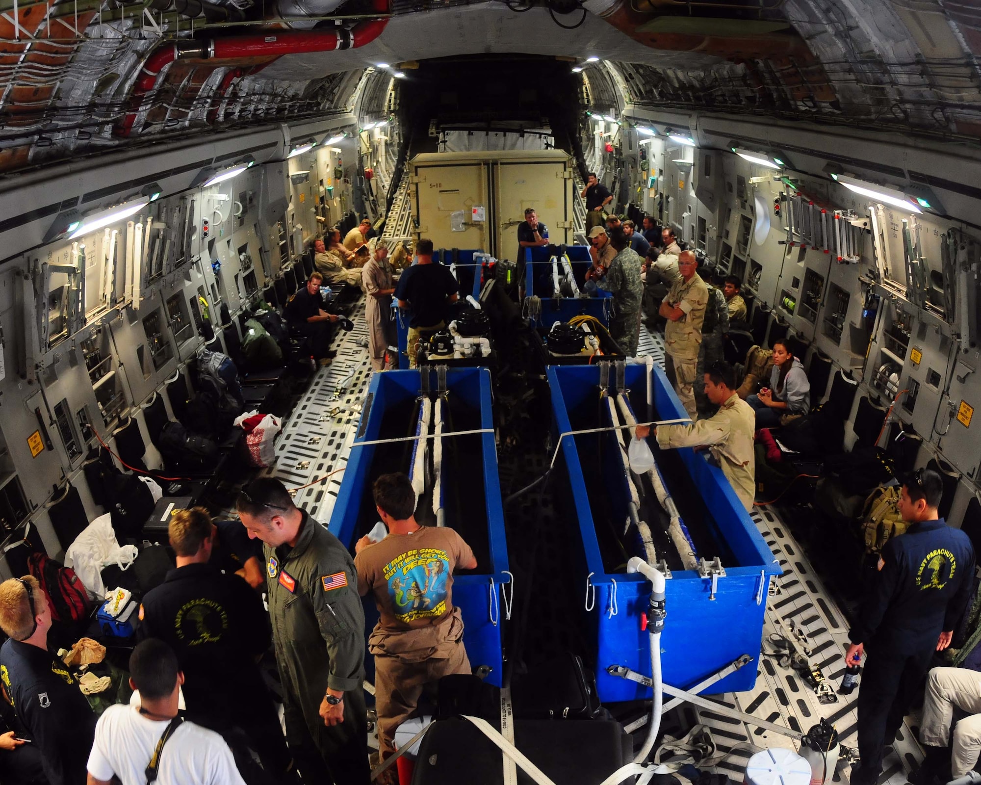 ALTUS AFB, Okla.- Members of the U.S. Navy Marine Mammal Fleet prepare four bottlenose dolphins for flight on the Altus Air Force Base C-17 Globemaster III from Norfolk Naval Station, Virginia to Point Loma Sub Base, San Diego, California June 14. The dolphins were in Norfolk for two weeks participating in the multinational exercise called Frontier Sentinel. (U.S. Air Force photo/Senior Airman Leandra D. Hernandez)