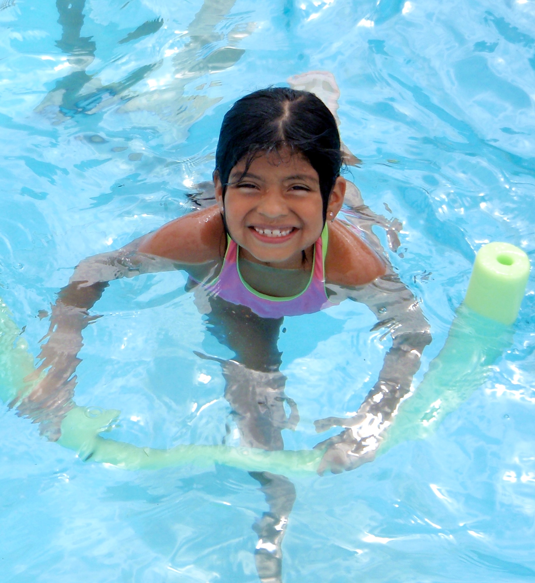 Allie Mathes, daughter of Maj. Marc Mathes with the 3rd Fighter Training Squadron, is one of the 500 swimmers who enjoyed the Plains Pool during the season opening Memorial Day weekend at Vance AFB. (U.S. Air Force photo/ Jessica Gibson)