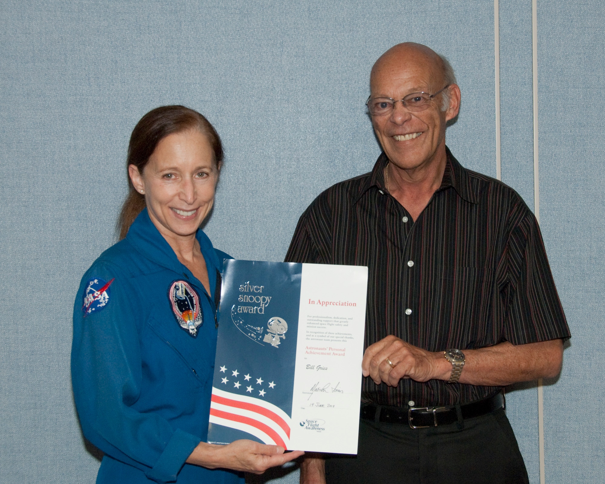 Recently retired Edwards Air Force Base airspace manager Bill Gries has been honored with a NASA "Silver Snoopy" award for his service as coordinator of space shuttle landing contingency support at Edwards. NASA astronaut Marsha Ivins presented the award to Mr. Gries during a brief ceremony at NASA's Dryden Flight Research Center June 14. A former air traffic controller at Edwards, Gries coordinated all space shuttle landing support activities from Department of Defense facilities in the high desert area, including the Naval Air Warfare Station at China Lake and Fort Irwin, Calif. (NASA photo by Tony Landis)