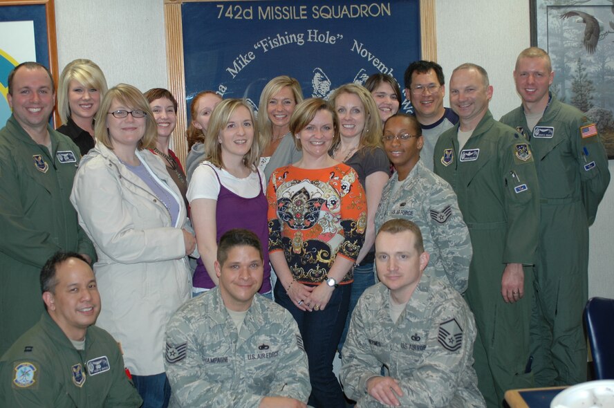 MINOT AIR FORCE BASE, N.D. -- Spouses and family members of the 742nd Missile Squadron pose for a group picture during their tour of the Oscar Missile Alert Facility and Launch Control Center here May 22. This was the first time the spouses club organized a family MAF and LCC tour in more than a year. (Courtesy photo)