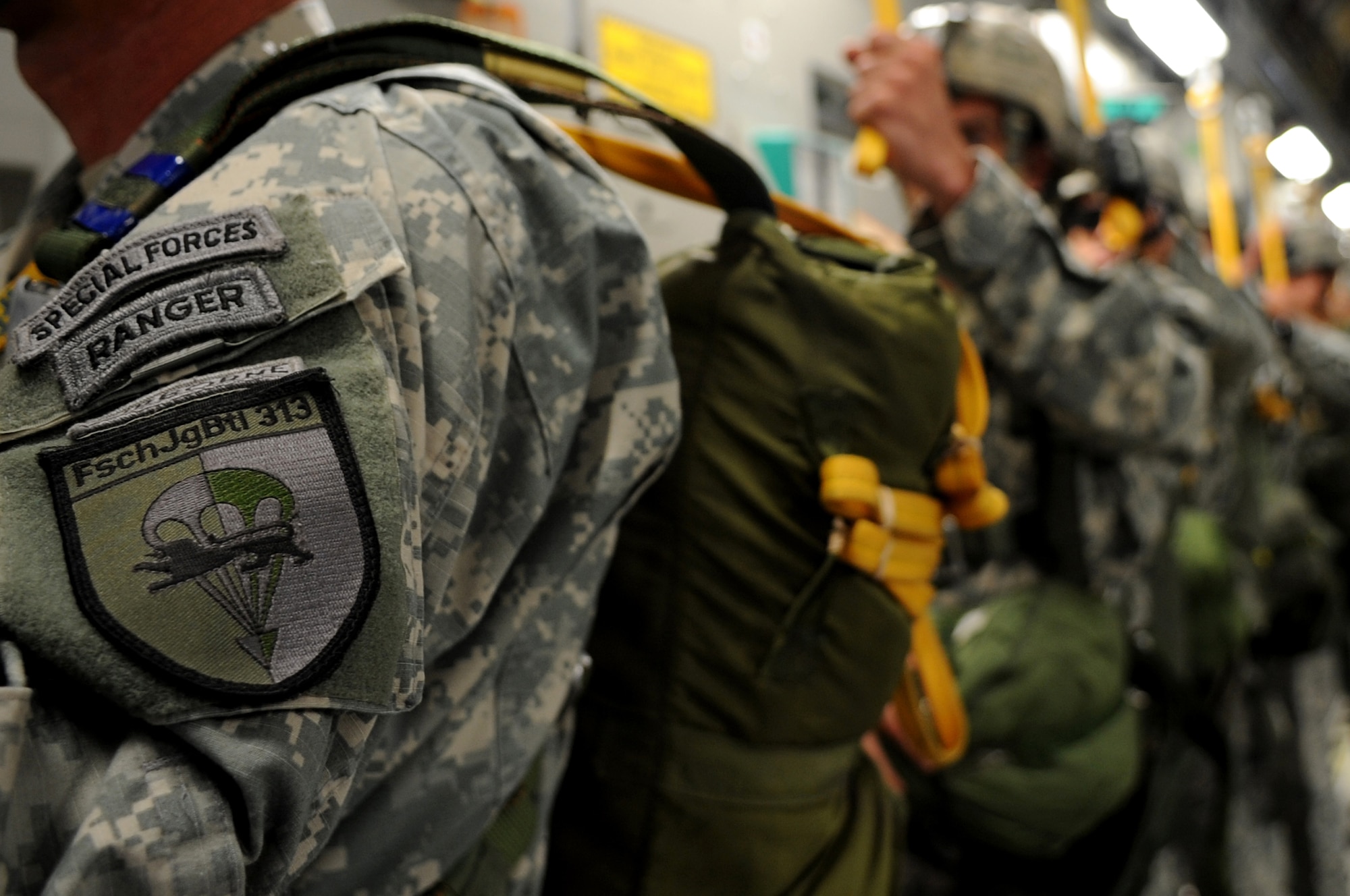 U.S. Army Soldiers prepare to execute an airborne jump off a C-17 Globemaster III over the drop zone, Alzey, Germany, June 15, 2010. This airborne jump is officially known as NATO Jump Week and is the first time a NATO jump is conducted from a C-17. Five NATO countries participated in the annual event to support one of United States Air Forces in Europe's top priorities; building partnerships. (U.S. Air Force photo by Airman 1st Class Grovert Fuentes-Contreras)(Released)