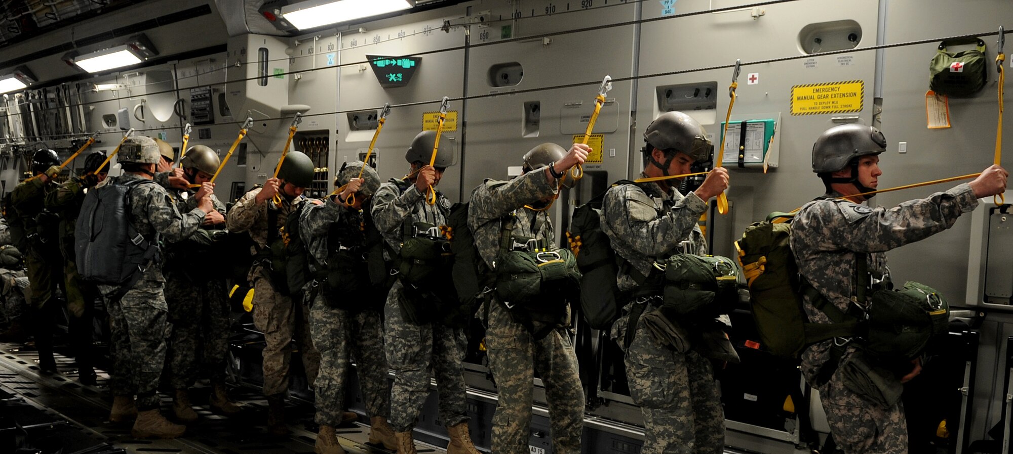 U.S. Air Force Airmen, U.S. Army Soldiers and Norway Army soldiers prepare to execute an airborne jump off a C-17 Globemaster III over the drop zone, Alzey, Germany, June 15, 2010. This airborne jump is officially known as NATO Jump Week and is the first time a NATO jump is conducted from a C-17. Five NATO countries participated in the annual event to support one of United States Air Forces in Europe's top priorities; building partnerships. (U.S. Air Force photo by Airman 1st Class Grovert Fuentes-Contreras)(Released)