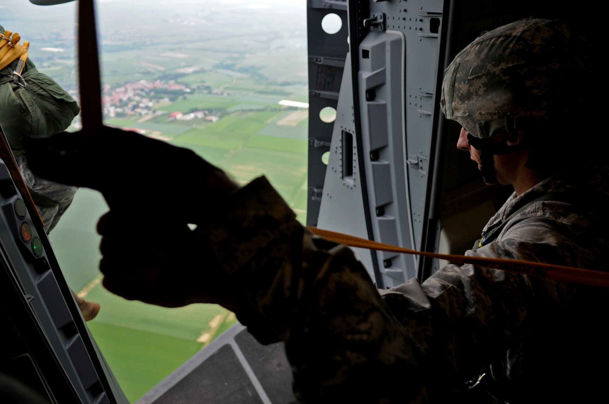 U.S. Air Force 1st Lt. Jordan Matthews, 435th Air Mobility Squadron, executes an airborne jump of a C-17 Globemaster III over the drop zone, Alzey, Germany, June 15, 2010. This airborne jump is officially known as NATO Jump Week and is the first time a NATO jump is conducted from a C-17. Five NATO countries participated in the annual event to support one of United States Air Forces in Europe's top priorities; building partnerships. (U.S. Air Force photo by Airman 1st Class Grovert Fuentes-Contreras)(Released)