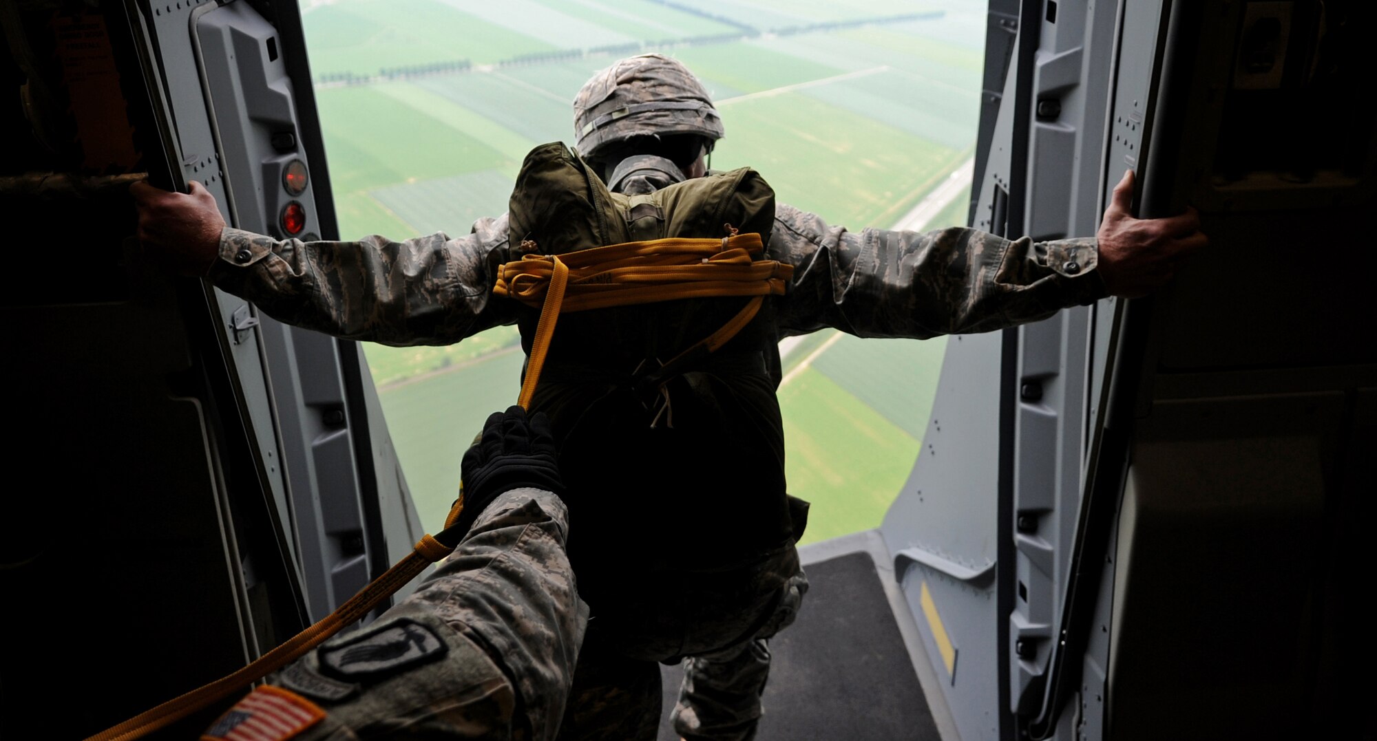 U.S. Air Force Col. Timothy Brown, 435th Contingency Response Group commander, performs pre-jump checks on a C-17 Globemaster III before executing an airborne jump over the drop zone, Alzey, Germany, June 15, 2010. This airborne jump is officially known as NATO Jump Week and is the first time a NATO jump is conducted from a C-17. Five NATO countries participated in the annual event to support one of United States Air Forces in Europe's top priorities; building partnerships. (U.S. Air Force photo by Airman 1st Class Grovert Fuentes-Contreras)(Released)
