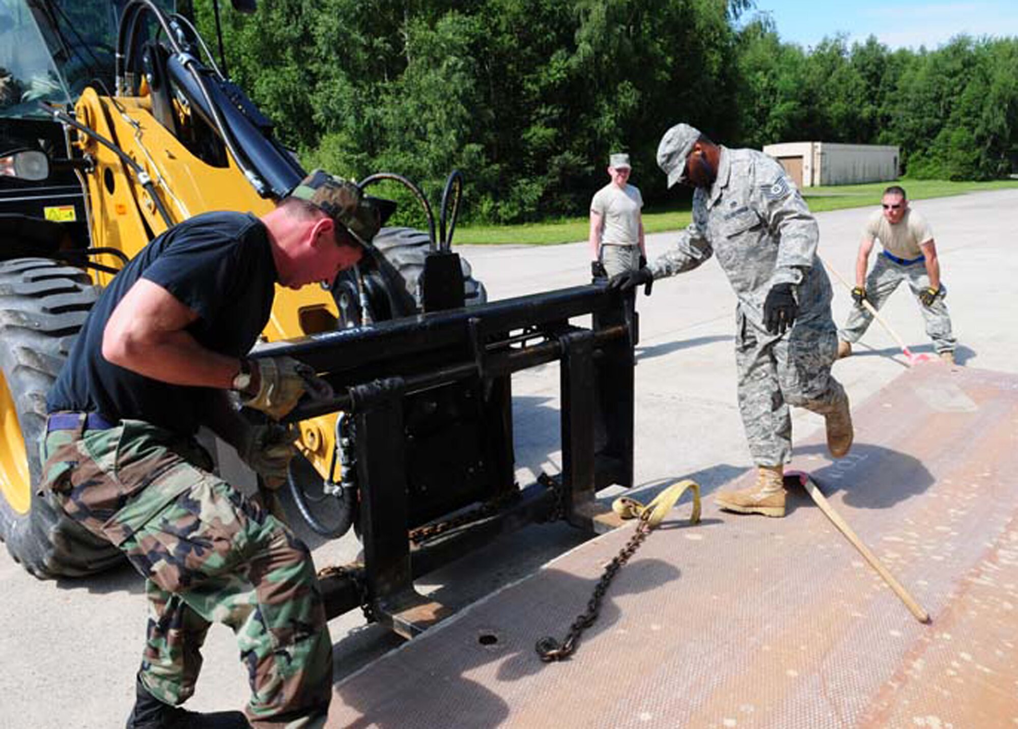 RAMSTEIN AIR BASE, Germany- Airmen from various civil engineer units across the Air Force work on a project during a Silver Flag exercise here June 9. About 53 Reservists from the 512th Civil Engineer Squadron, Dover Air Force Base, Del., went to Silver Flag along with 30 Airmen from the 436th Civil Engineer Squadron, Dover AFB. Silver Flag prepares CE Airmen for real-world duties in deployed locations. (U.S. Air Force photo/Airman 1st Class Desiree Esposito)