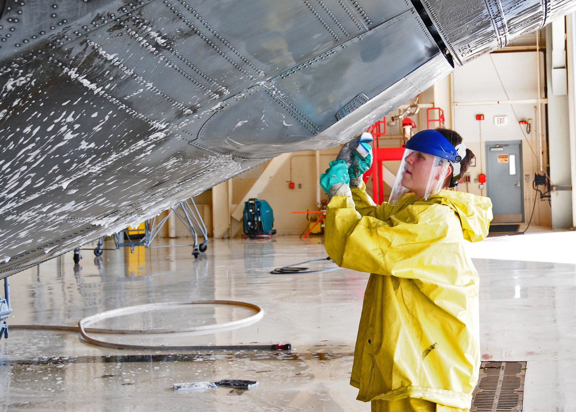 Members of the 914th Airlift Wing wash down a C-130 in hanger 901, May 27, 2010, Niagara Falls Air Reserve Station, Niagara Falls, NY. Aircraft become dirty from exhaust and from the particulates in the air and are routinely washed down as part of maintenance. (U.S. Air Force by Staff Sgt. Joseph McKee)