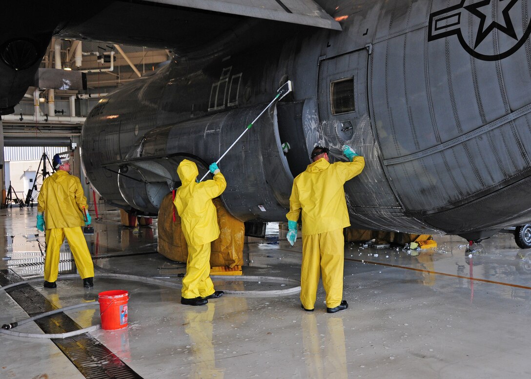 Members of the 914th Airlift Wing wash down a C-130 in hanger 901, May 27, 2010, Niagara Falls Air Reserve Station, Niagara Falls, NY. Aircraft become dirty from exhaust and from the particulates in the air and are routinely washed down as part of maintenance. (U.S. Air Force by Staff Sgt. Joseph McKee)