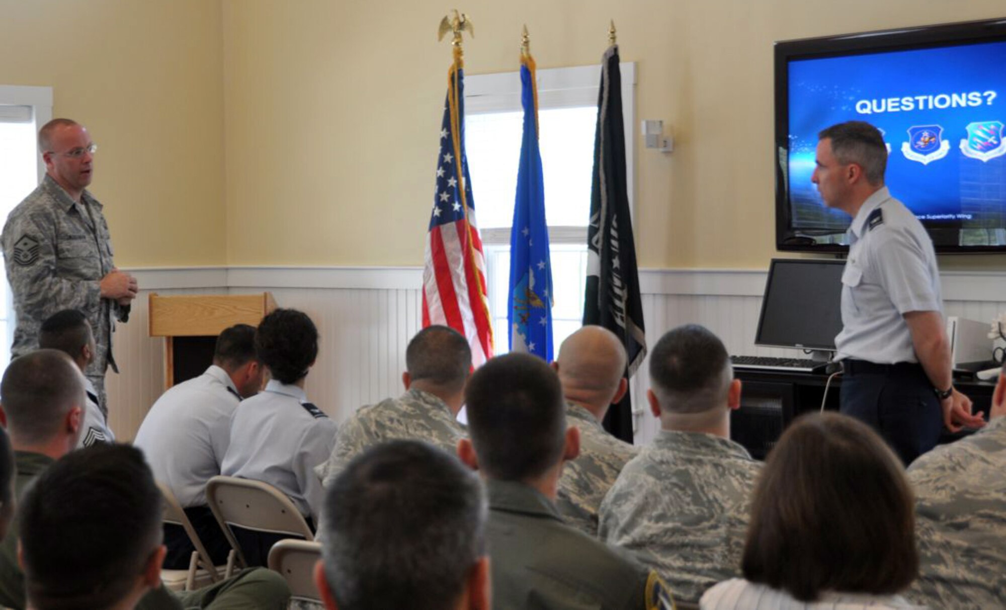 Master Sgt. Scott Crossman, 6th Space Warning Squadron first sergeant, asks Col. Stephen N. Whiting, 21st Space Wing commander, about the financial future of the Air Force and AF Space Command questions during the 21st SW Commander’s Call at Cape Cod Air Force Station, Mass. Colonel Whiting traveled to the 6th SWS for the meeting, and helped mark the 30th anniversary of the Pave PAWS radar system there. The 6th SWS is a geographically separated unit of the 21st Space Wing, and uses the Pave PAWS radar to guard North America's east coast against sea-launched missiles and ICBMs. (U.S. Air Force photo/2nd Lt. Keturah Spence)