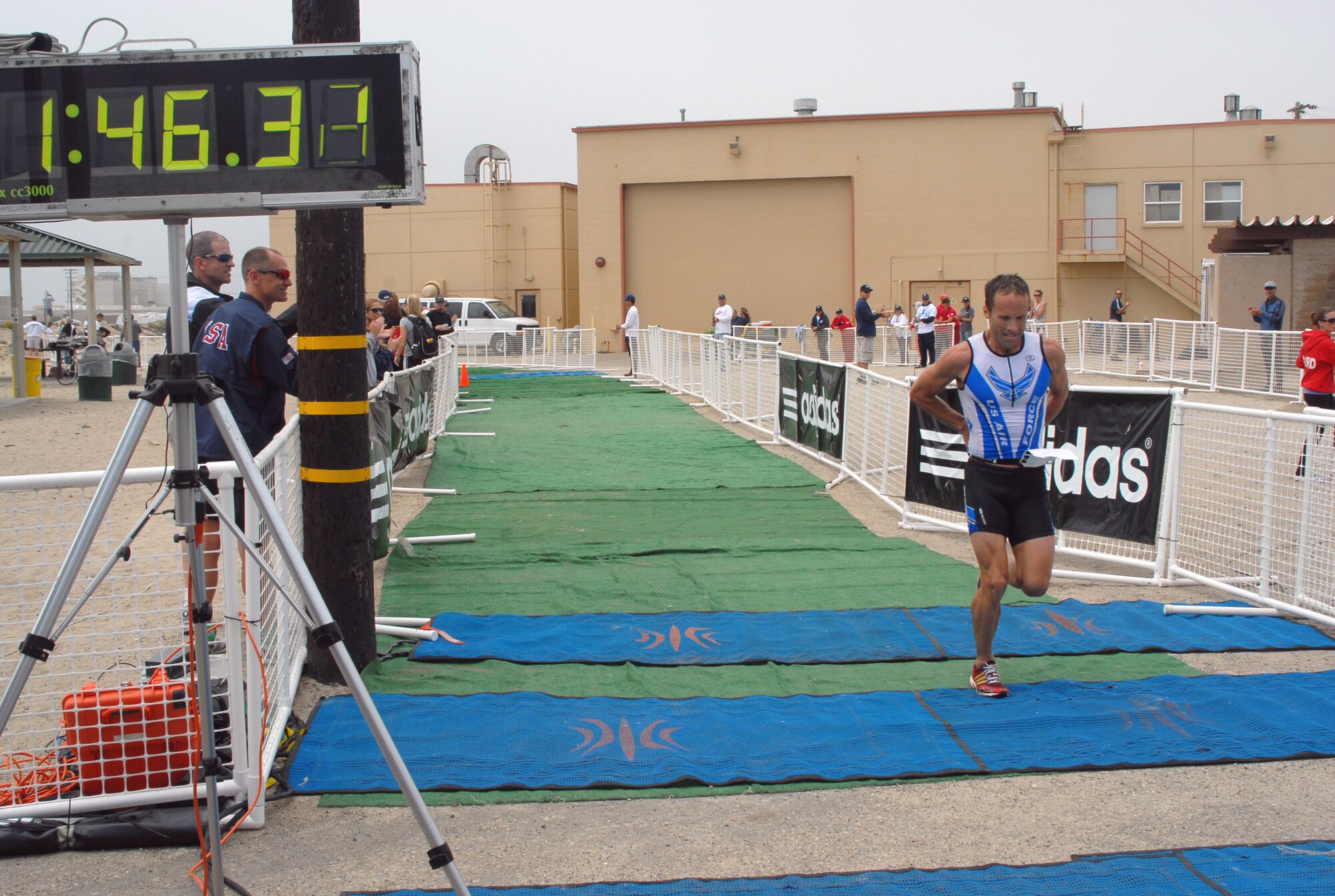Capt. James Bales is the first to cross the finish line in the men's Armed Forces Triathlon Championship June 5, 2010, at Naval Base Ventura County, Calif. (U.S. Navy photo/Mass Communications Specialist 1st Class Aaron Peterson)