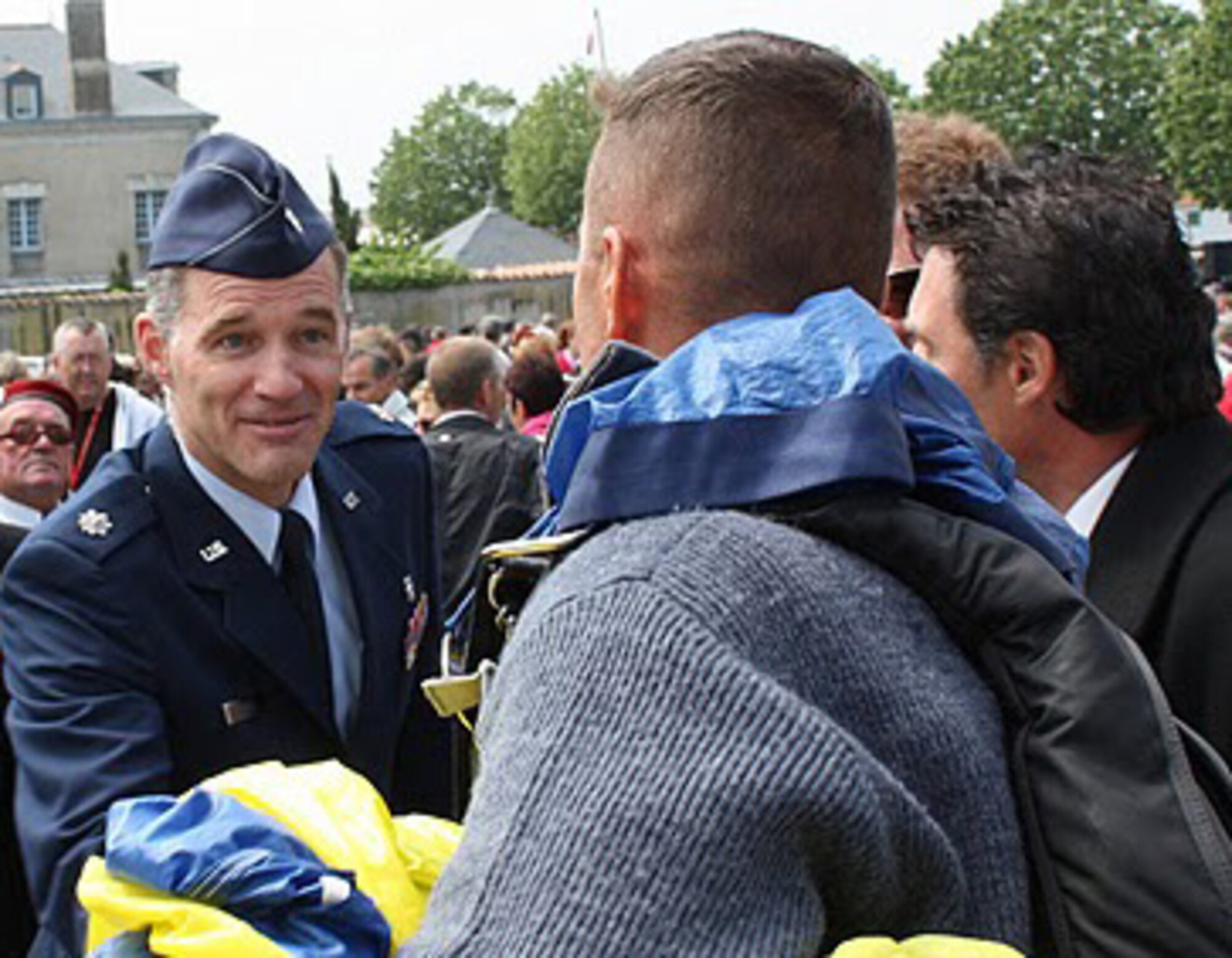 Lt. Col. Kirk Rowe, a clinical neuropsychologist and 96th Mental Health Flight Commander, shakes hands with citizens of Noirmoutier-en-I'lle, France.  The colonel and his wife, Christina, were part of a delegation that visited Crestview's sister city. (courtesy photo