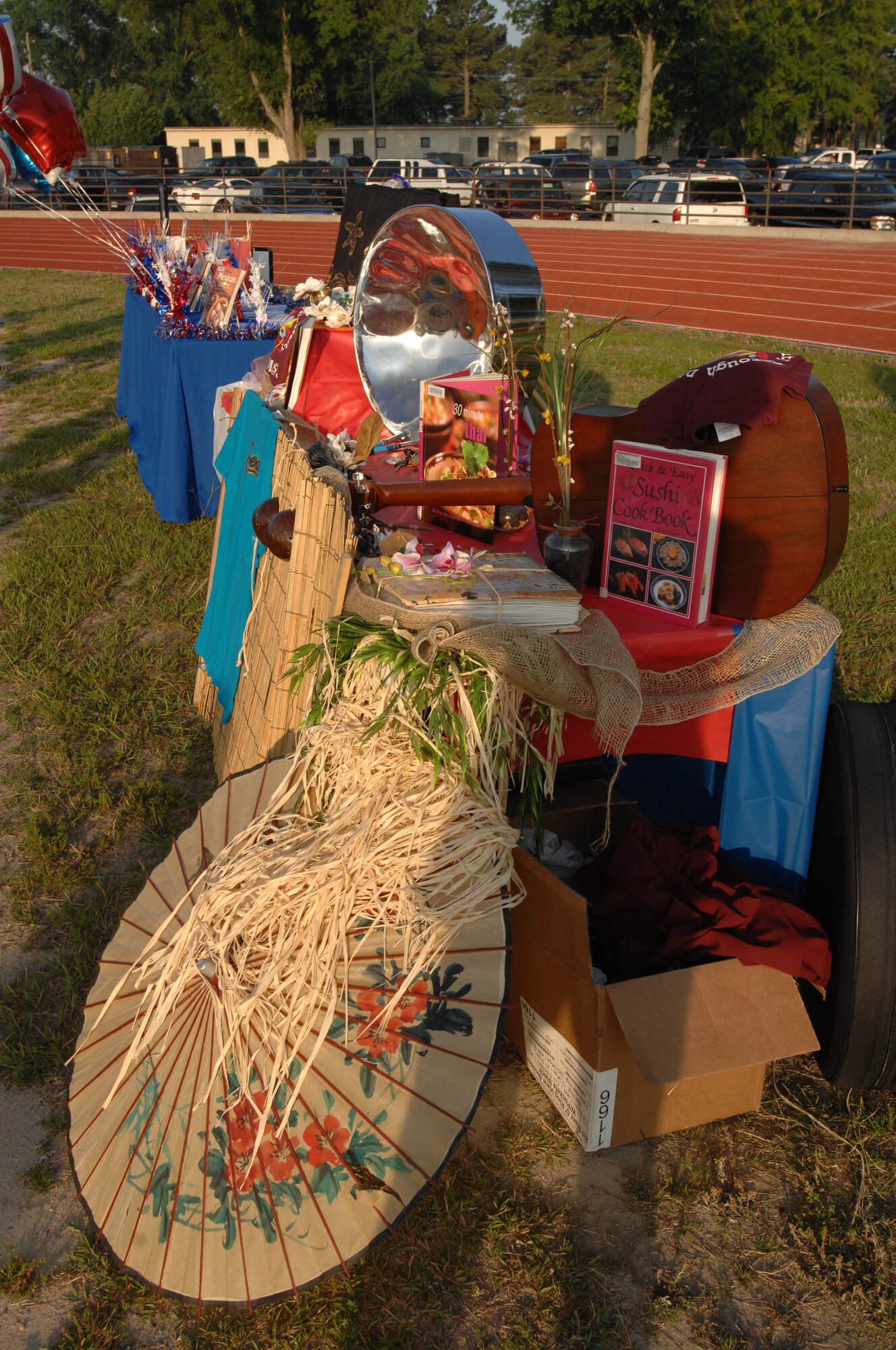 SEYMOUR JOHNSON AIR FORCE BASE, N.C. -- The 4th Fighter Wing Equal Opportunity Office hosted a Multicultural Day 2-mile run/walk June 11, 2010. The EO staff assembled a table featuring several items from various cultures represented in the Air Force including cookbooks, flowers and educational pamphlets for racers to check out as they cooled down after the race. (U.S. Air Force photo/Tech. Sgt. Tammie Moore) 