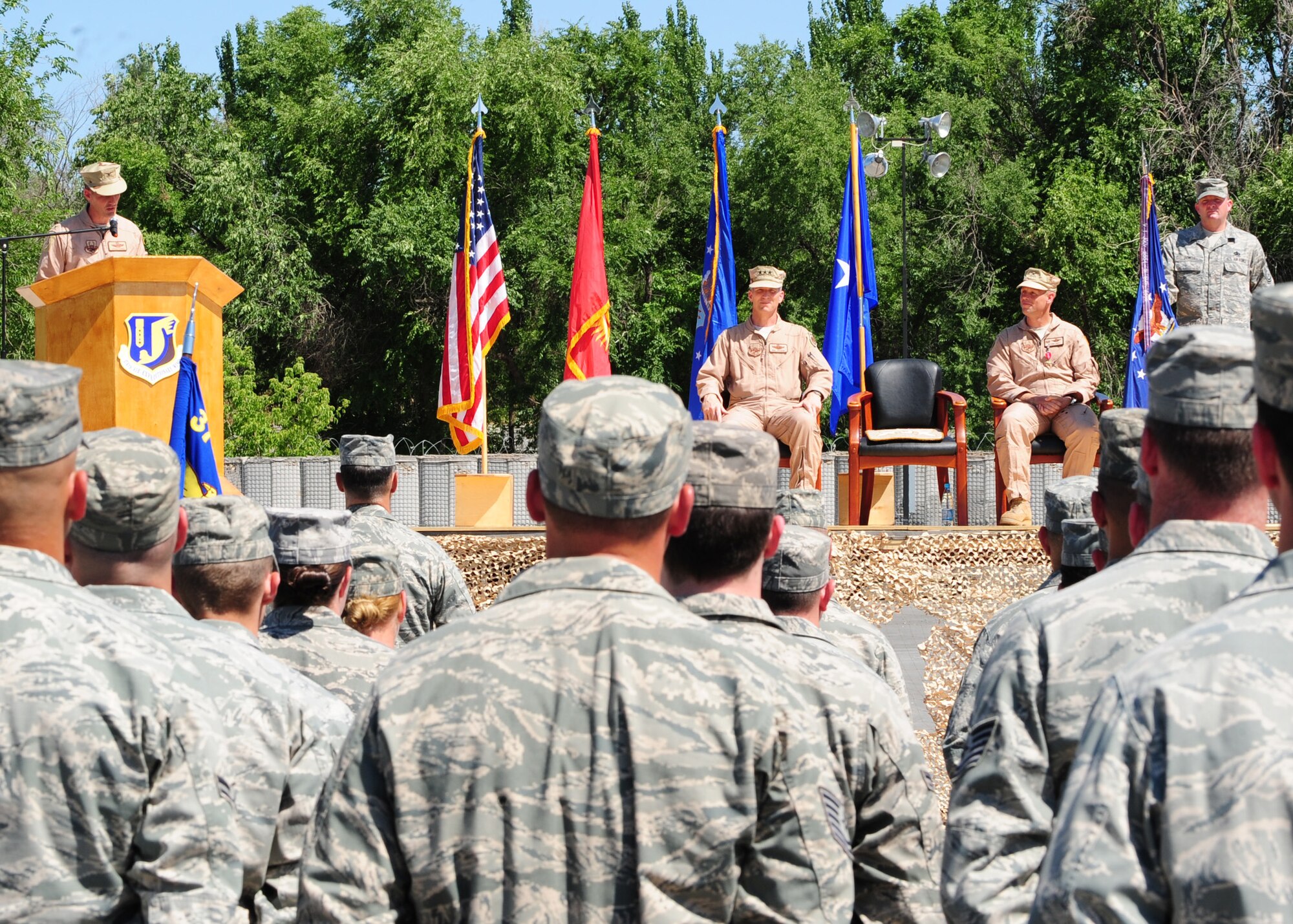 Col. Dwight C. Sones addresses the 376th Air Expeditionary Wing and visitors for the first time as the new commander during the change of command ceremony at the Transit Center at Manas, Kyrgyzstan, June 15, 2010. Colonel Sones was previously the Vice Commander, 436th Airlift Wing, Dover Air Force Base, Del. The primary purpose of a change of command ceremony is to allow subordinates to witness the formal transfer of total responsibility, authority, and accountability from one officer to another. (U.S. Air Force photo/ Senior Airman Nichelle Anderson/ released)