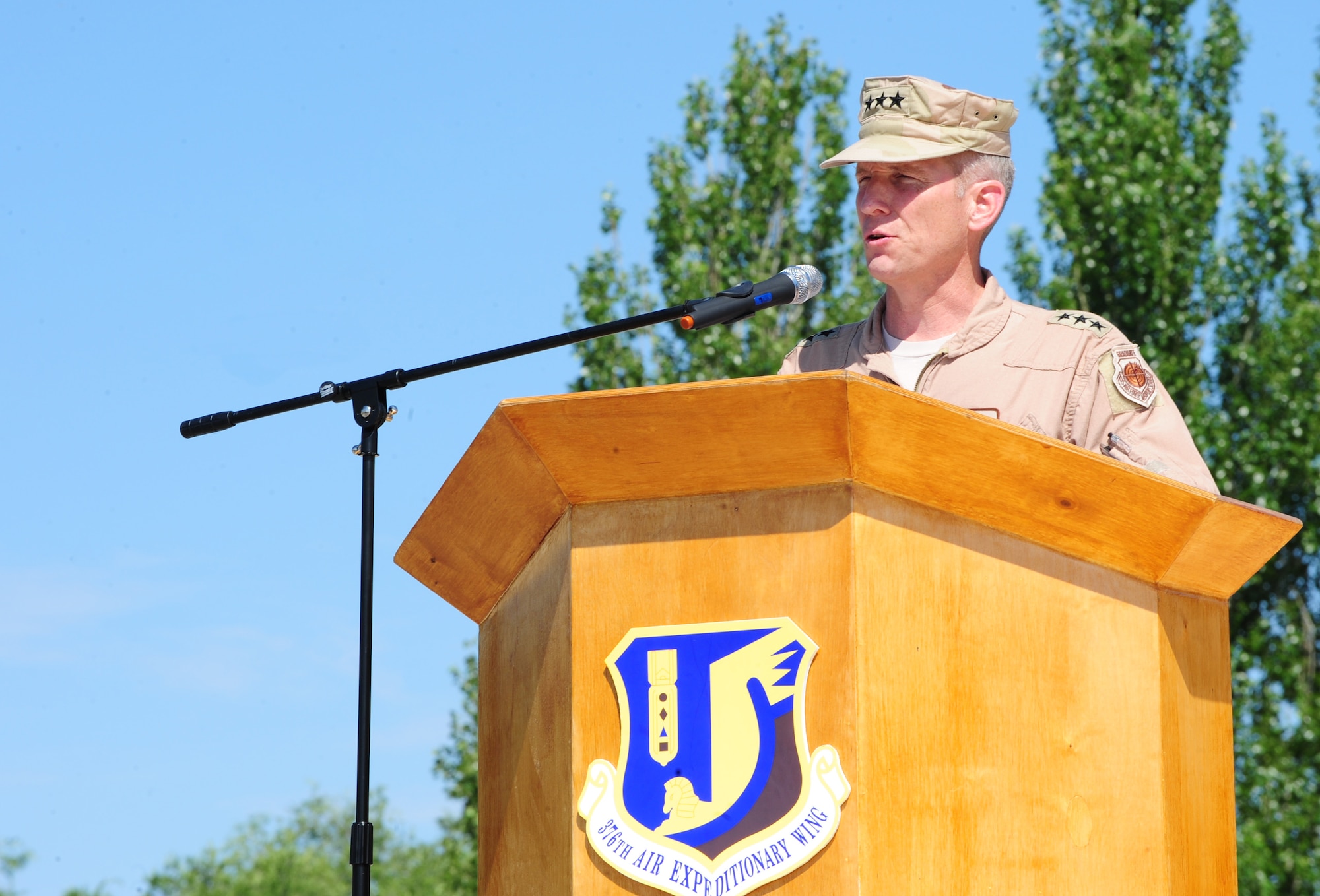 Lt. Gen. Mike Hostage, Commander, U.S. Air Forces Central Command, Southwest Asia, presides over the change of command for the 376th Air Expeditionary Wing, during which Col. Blaine D. Holt relinquished command to Col. Dwight C. Sones at the Transit Center at Manas, Kyrgyzstan, June 15, 2010. The primary purpose of a change of command ceremony is to allow subordinates to witness the formal transfer of total responsibility, authority, and accountability from one officer to another. (U.S. Air Force photo/ Senior Airman Nichelle Anderson/ released)