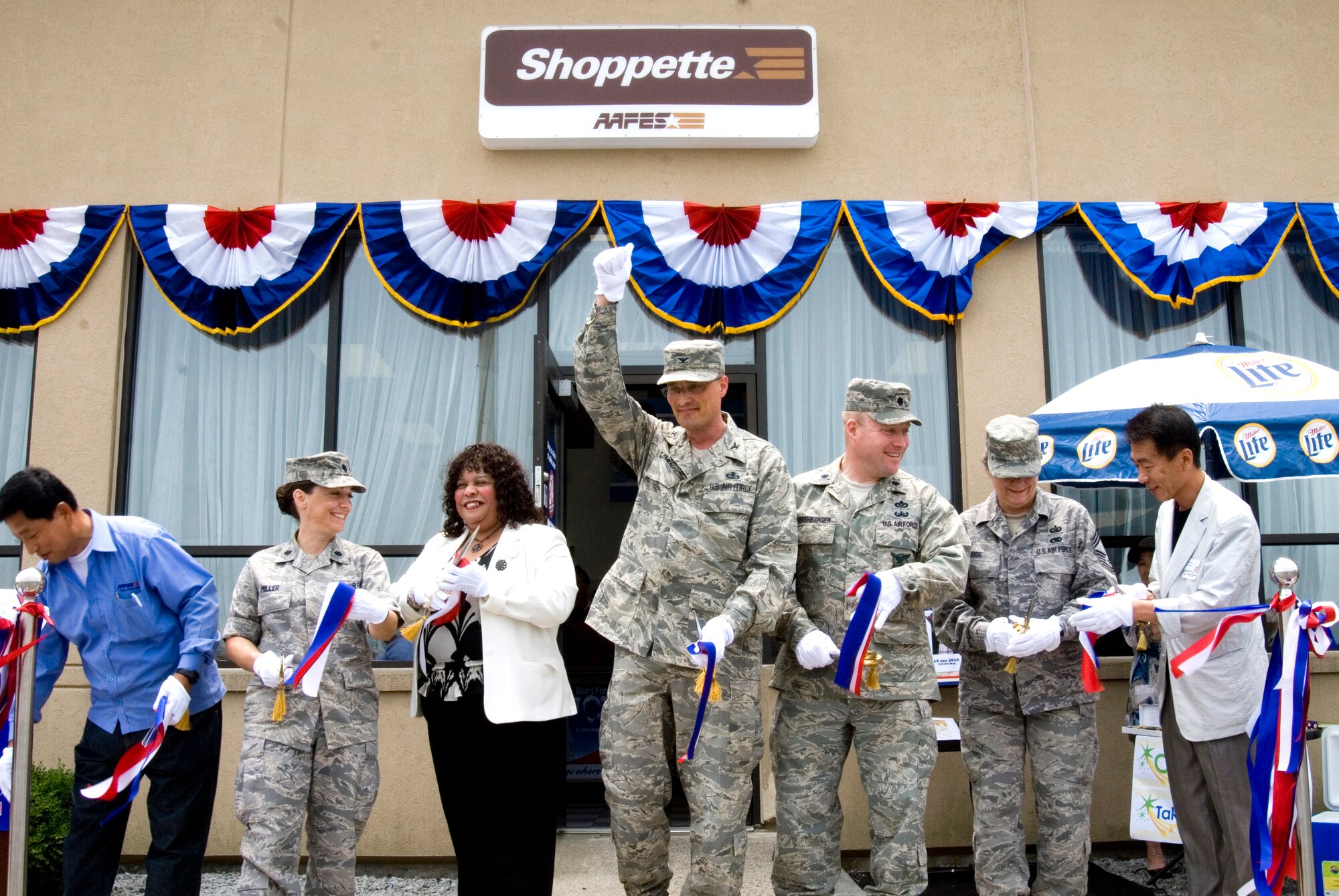 KUNSAN AIR BASE, Republic of Korea -- Col. Patrick Clements, 8th Mission Support Group Commander, leads other distinguished guests in a ribbon cutting during the grand opening of the new base shoppette. The shoppette construction began April 26 and was complete on May 26, costing approximately $41,000 to build. The hours of operation are 7:30 a.m. to 10 p.m. Monday through Thursday, 7:30 a.m. to 11 p.m. Friday and Saturday, and 10 a.m. to 10 p.m. Sunday. (U.S. Air Force photo/Staff Sgt. Jonathan Pomeroy)