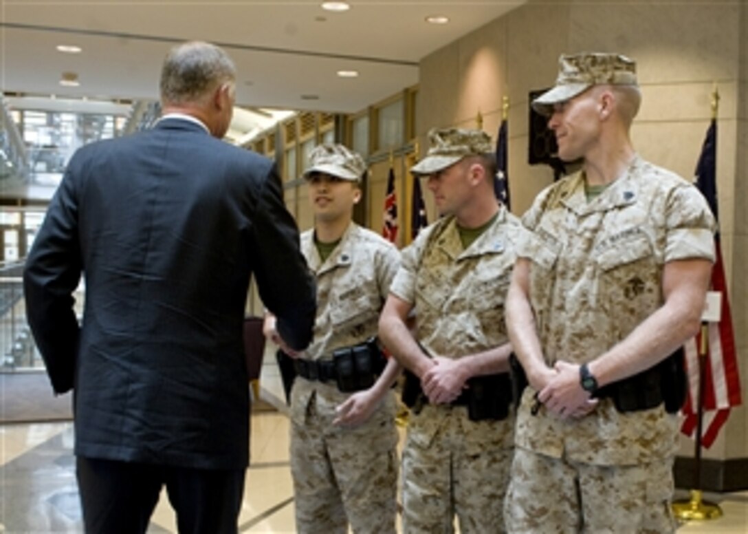 Deputy Secretary of Defense William J. Lynn III (left) meets with U.S. Marines assigned to the U.S. Embassy in Ottawa, Canada, on June 14, 2010.  