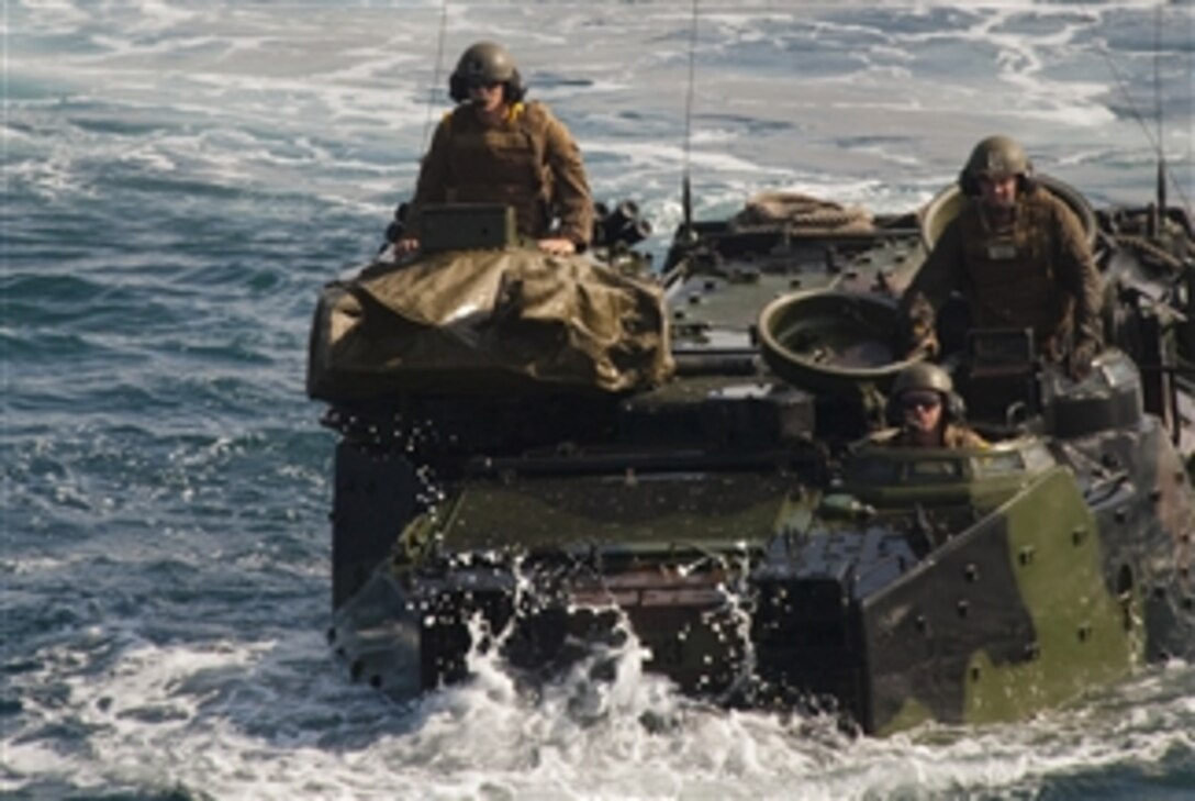 U.S. Marines from the Special Purpose Marine Air Ground Task Force 24 from Camp Pendleton, Calif., prepare to enter the well deck of the USS New Orleans (LPD 18) in amphibious assault vehicles in the eastern Pacific Ocean on June 11, 2010.  