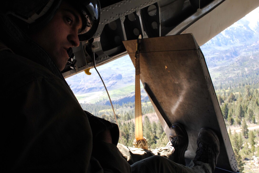 A Crew Chief aboard a CH-53E prepares to land a helicopter full of Marines in support of Exercise Javelin Thrust 2010.