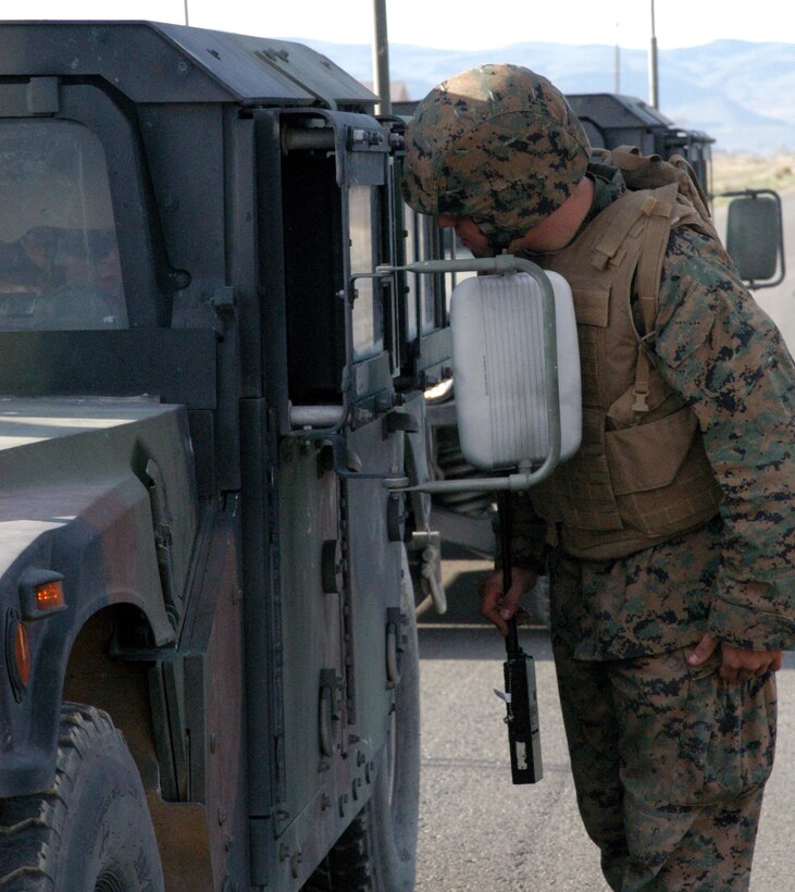 Lance Cpl. Alexander Willouer, a Doyle’s Town, Penn. native, checks vehicles at the gate at Hawthorne Army Weapons Depot, Hawthorne, Nev. June 15, 2010 during Javelin Thrust 2010.  Convoys are moving personnel and equipment in and out of Hawthorne to their training areas in several different terrains.  Javelin Thrust is designed to simulate the diverse operational environments of Afghanistan.