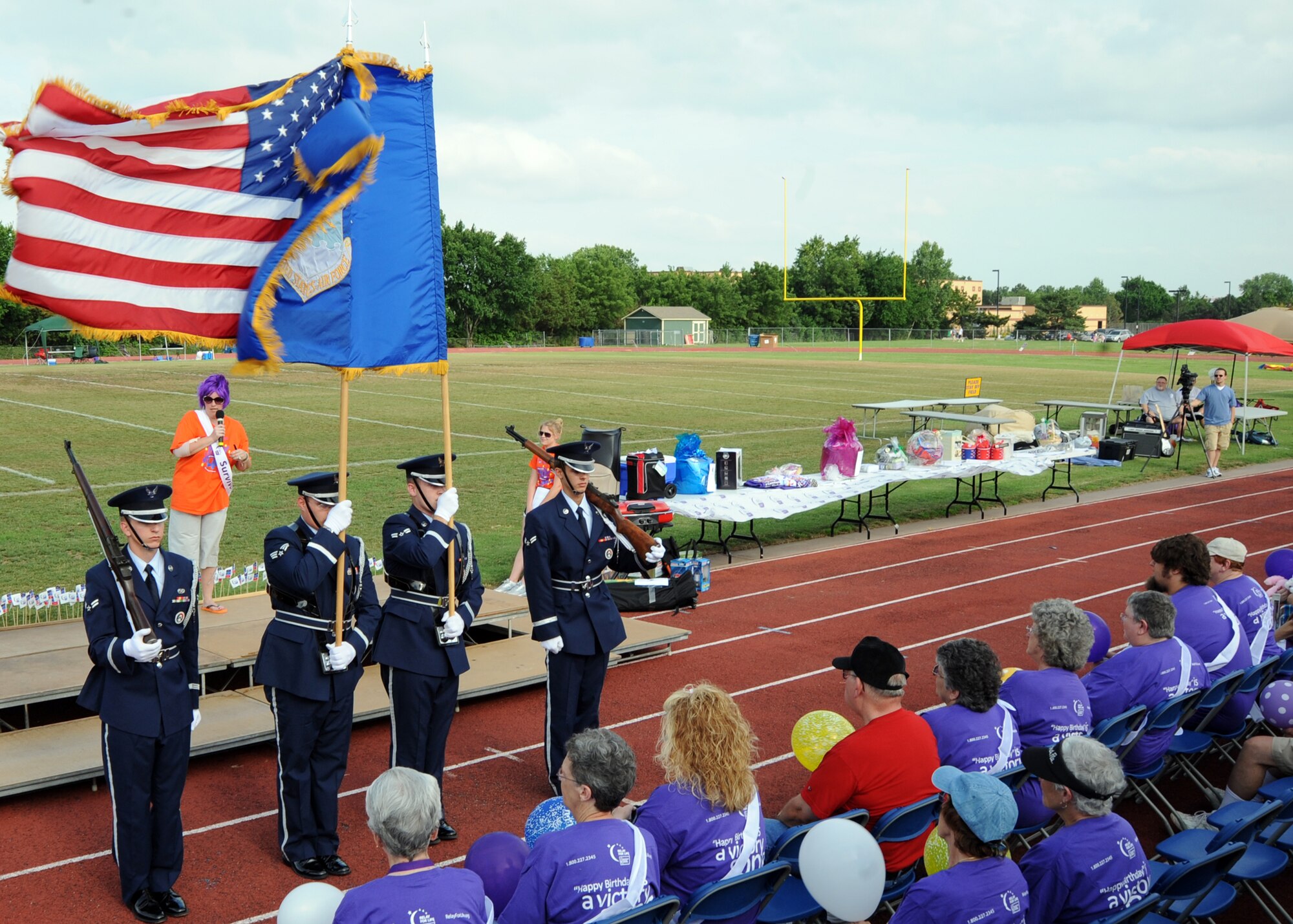 McConnell’s Honor Guard presents the colors during the American Cancer Society’s “Relay for Life” event at Collegiate High School, June 11, 2010, Wichita, Kan.  Team McConnell’s participation showcased the involvement of servicemembers within the community.   Relay for Life is a global event that celebrates the lives of people who have battled cancer and a time to remember loved ones who have died from the disease. (U.S. Air Force photo/Airman 1st Class Andrea Salazar) 