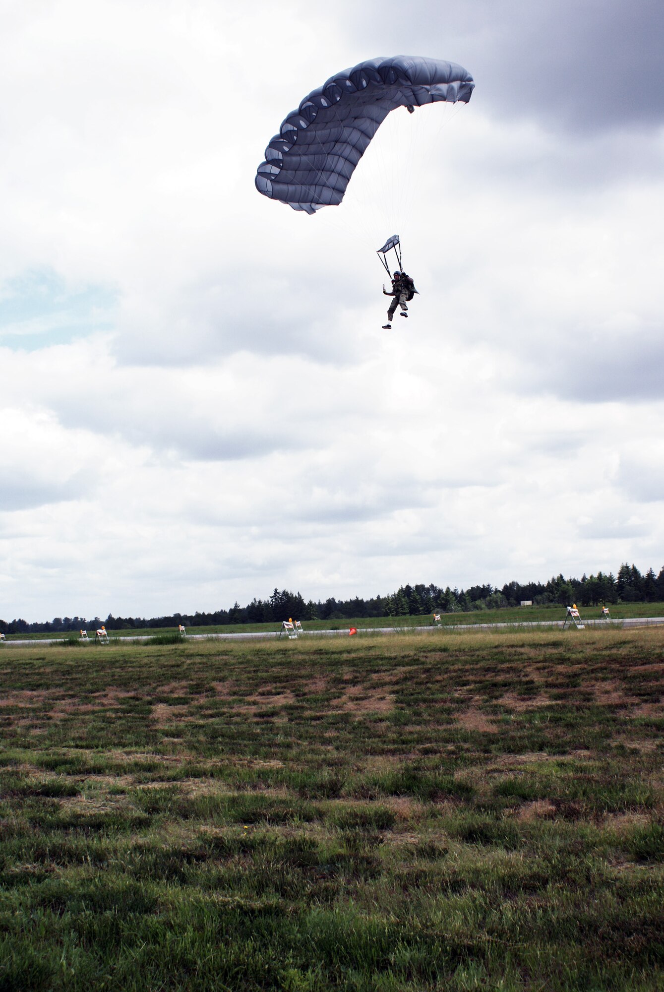 Staff Sgt. Shaun Meadows prepares to land as he completes a his jump on June 14, 2010. Sergeant Meadows is assigned to the 22nd Special Tactics Squadron at Joint Base Lewis-McChord, Wash. (U.S. Air Force photo/Airman Leah Young)