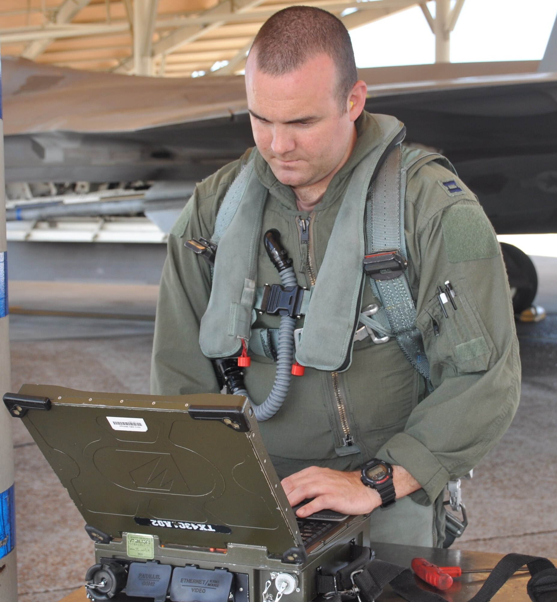 Captain Charles Schuck, 43rd Fighter Squadron instructor pilot, conducts his preflight inspections of an F-22 Raptor June 16 at Tyndall Air Force Base.  Captain Schuck will be attending the United States Air Force Weapons School located at Nellis Air Force Base, Nev.  (U.S. Air Force photo by Senior Airman Veronica McMahon)