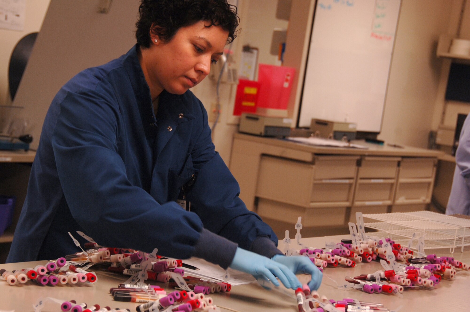 Ms. Cassandra Marke, medical lab technician, 59th Laboratory Squadron, sorts through and documents blood donor samples on June 10 at the blood donor center, Lackland Air Force Base, Texas. The facility tests all blood donor samples for more than 50 sites in the United States Central Command. The testing focuses on preventing transfusion-transmitted diseases in the USCENTCOM area of responsibility. (U.S. Air Force photo by Senior Airman Nicole Mickle)