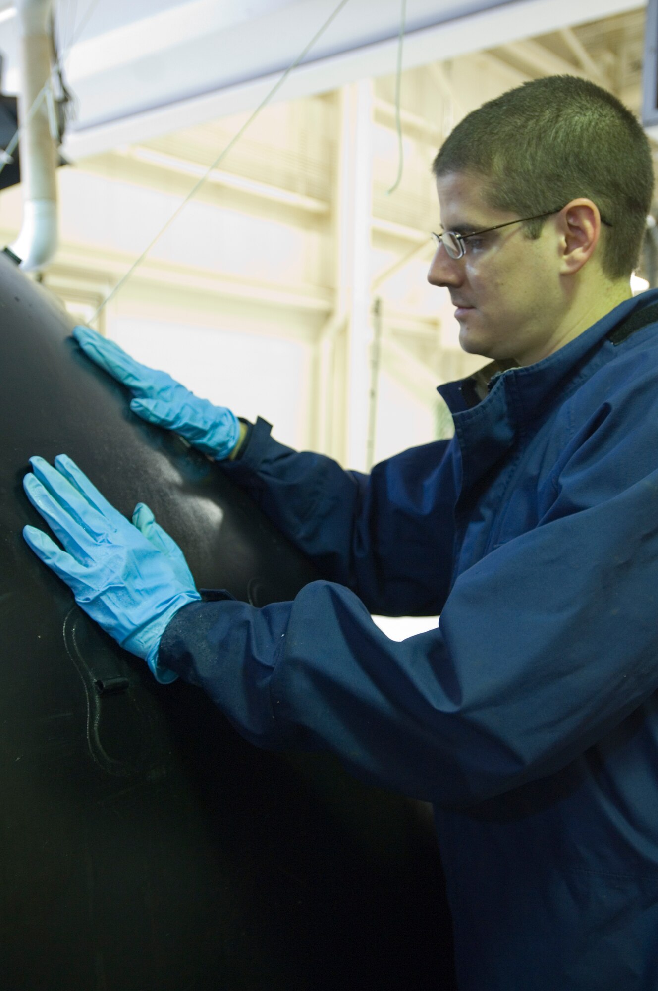 Tech. Sgt. Casey Tanner, 22nd Maintenance Squadron Aircraft Fuel Systems craftsmen, performs a “soap sud” test on a KC-135 Stratotanker fuel bladder for June 15, 2010, McConnell Air Force Base, Kan.  The test makes it easier to determine the location of any leaks in the fuel bladder. (U.S. Air Force photo/Senior Airman Abigail Klein)