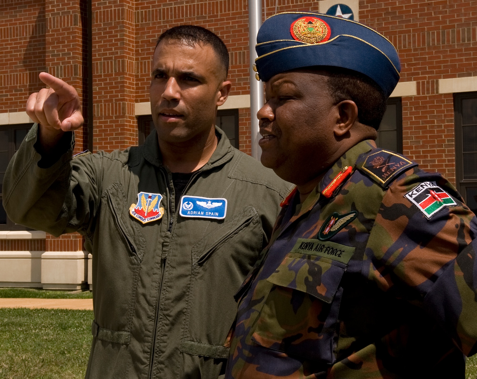 LANGLEY AIR FORCE BASE, Va. -- Lt. Col. Adrian Spain, 94th Fighter Squadron commander, speaks with Kenya Air Force Lt. Gen. Julius Waweru Karangi, Kenyan Armed Forces Vice Chief of the General Staff, June 7.  Karangi visited Langley to gather a firsthand perspective of U.S. Air Force operations.  (U.S. Air Force photo/Senior Airman Zachary Wolf)
