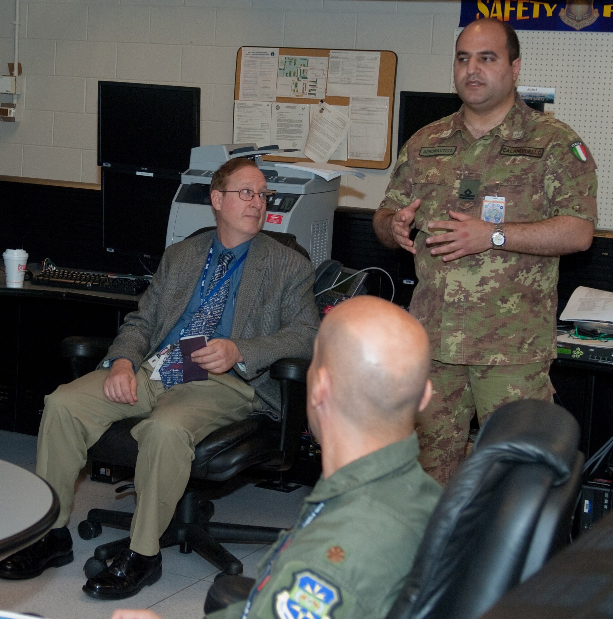 First Lt. Gianfranco Calandriello of the Italian Air Force speaks to other participants of the Coalition Warrior Interoperability Demonstration during set up at Hanscom AFB June 8. CWID presents C4ISR solutions for today's warfighters.
For CWID 2010, the 653rd Electronic Systems Wing's Enterprise Integration Division will offer tours June 21, 22 and 24 at Hanscom's C4ISR Enterprise
Integration Facility and the division's renovated tactical shelters. To sign up for a tour, please register at www.cwid.js.mil.  (U.S. Air Force photo by Rick Berry)
