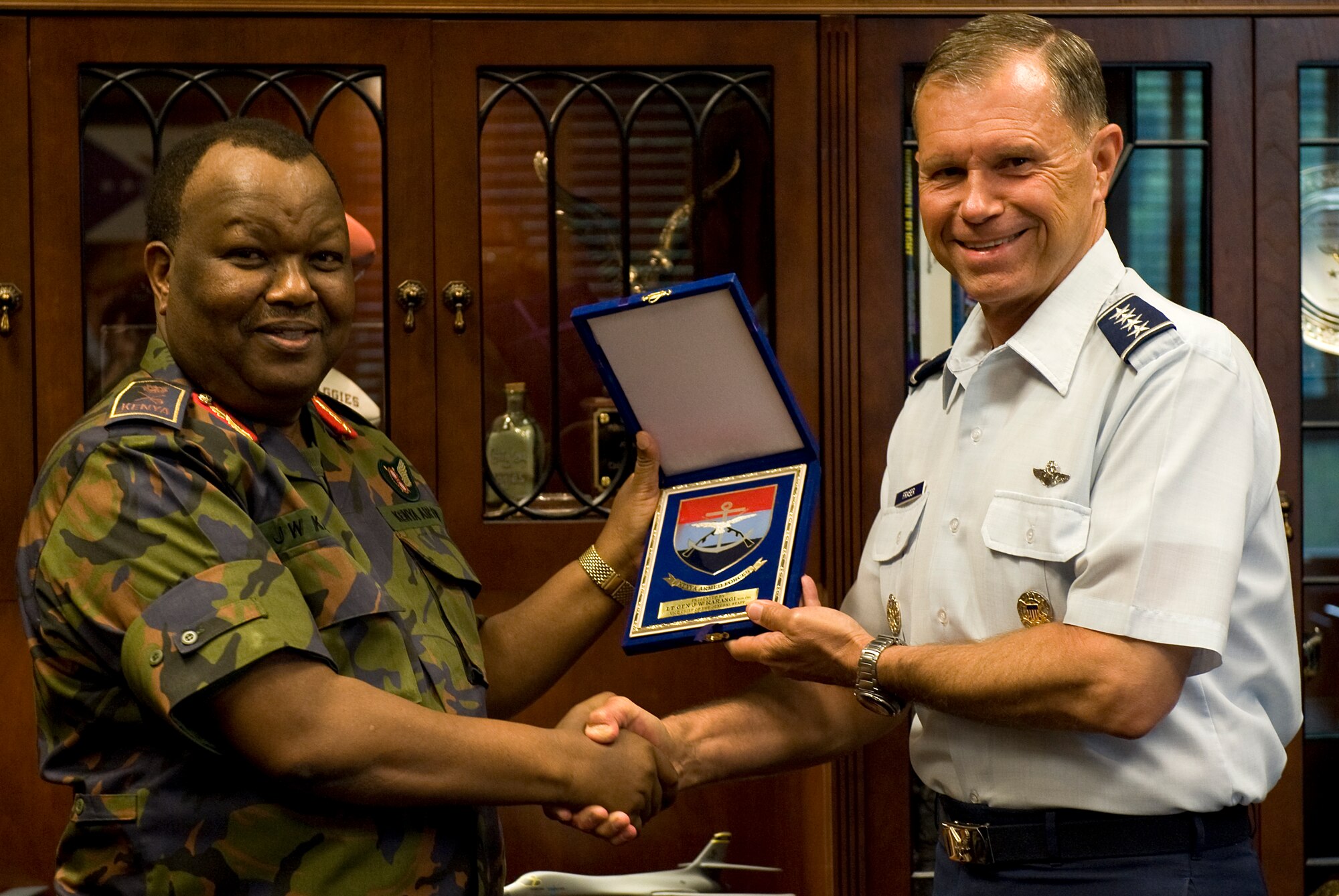 LANGLEY AIR FORCE BASE, Va. -- Kenya Air Force Lt. Gen. Julius Waweru Karangi, Kenyan Armed Forces Vice Chief of the General Staff, presents a memento to Gen. William M. Fraser III, Air Combat Command commander, June 7.  Karangi visited Langley to gather a firsthand perspective of U.S. Air Force operations.  (U.S. Air Force photo/Senior Airman Zachary Wolf)
