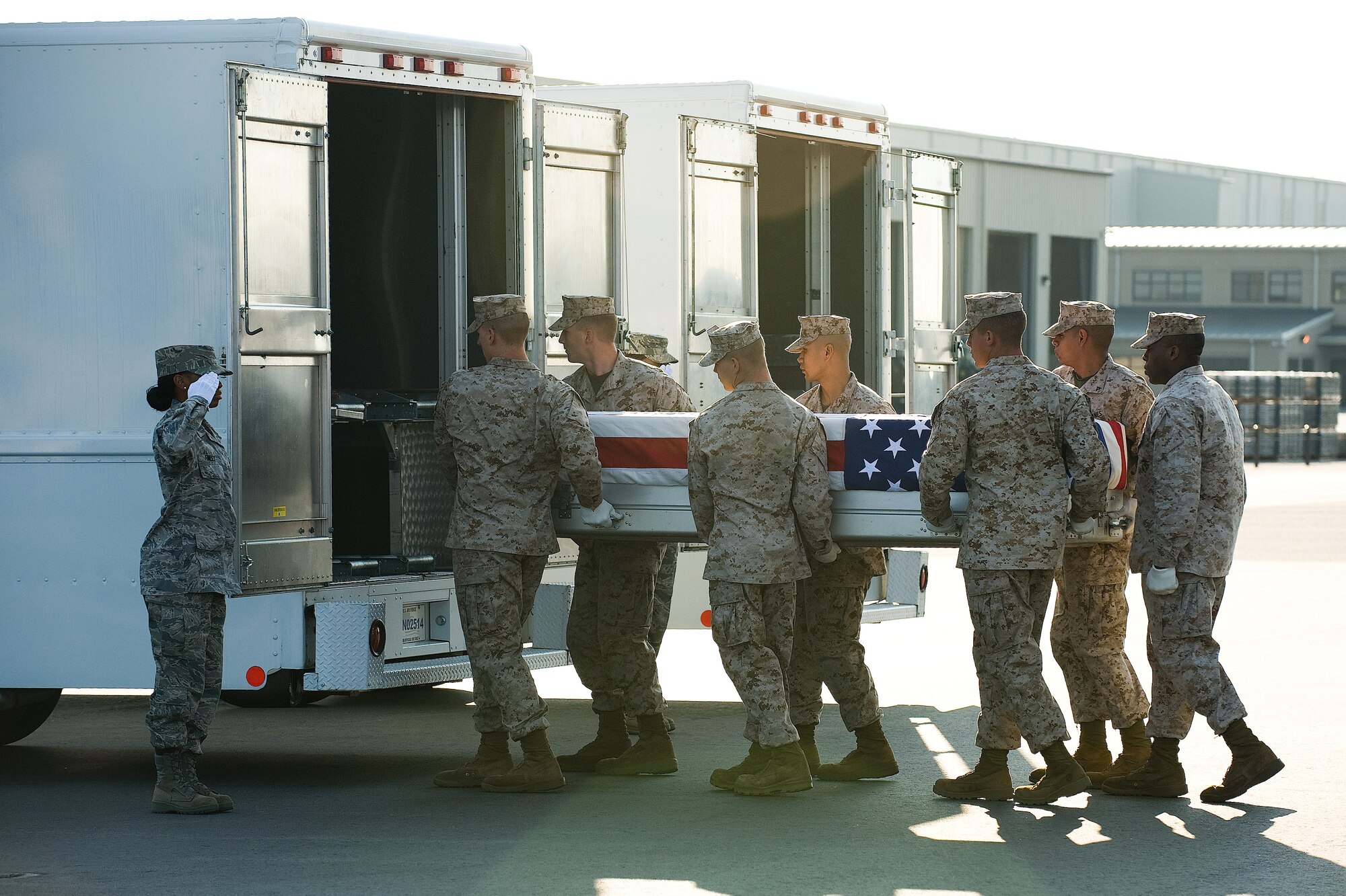 11 June 2010  USAF Photo by Jason Minto.  A U.S. Marine Corps carry team transfers the remains of Marine LCpl Michael G. Plank of Cameron Mills, NY., at Dover Air Force Base, Del., June 11, 2010.  