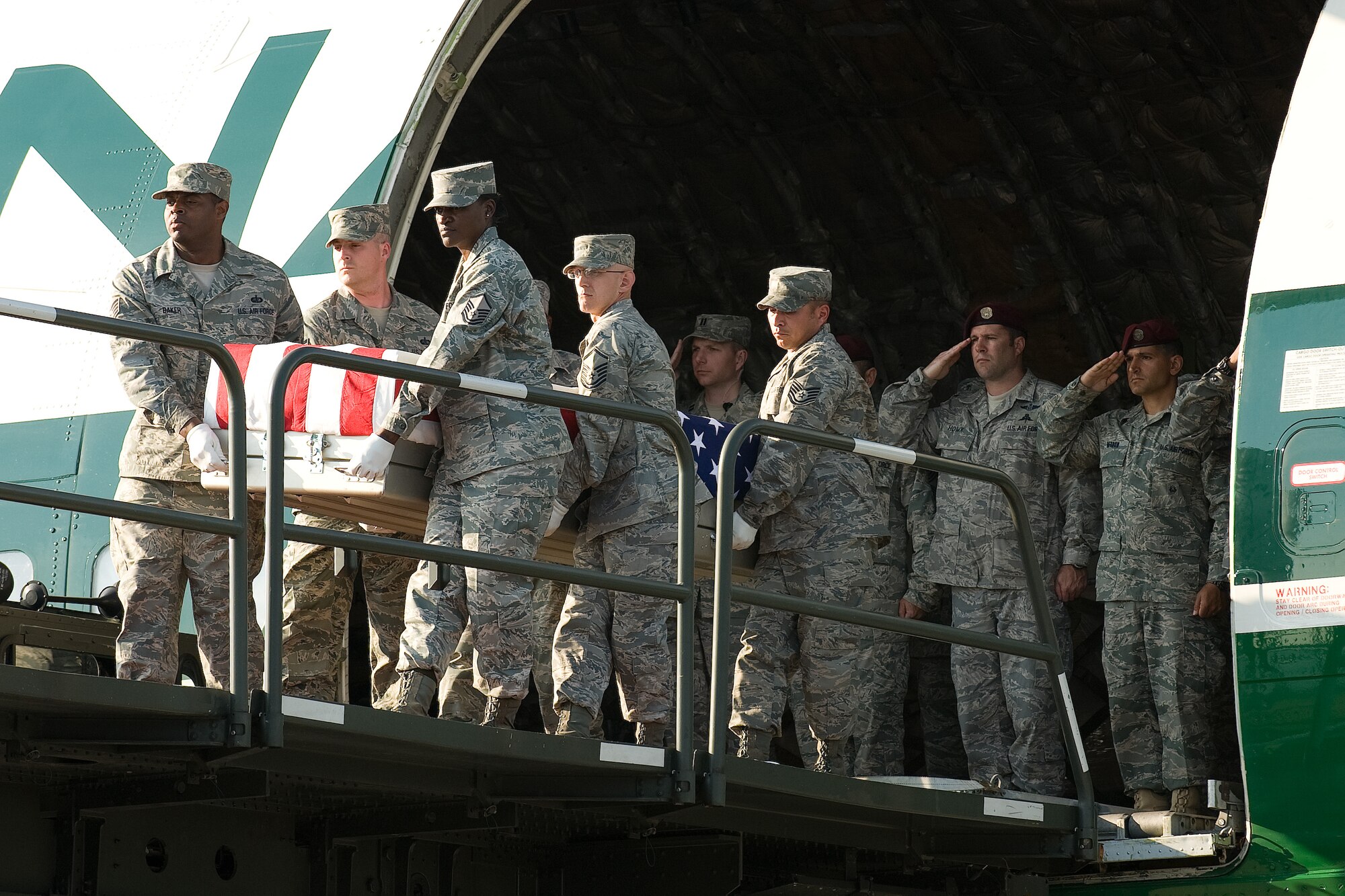 11 June 2010  USAF Photo by Jason Minto.  A U.S. Air Force carry team transfers the remains of Air Force SrA Benjamin D. White of Erwin, TN, at Dover Air Force Base, Del., June 11, 2010.  