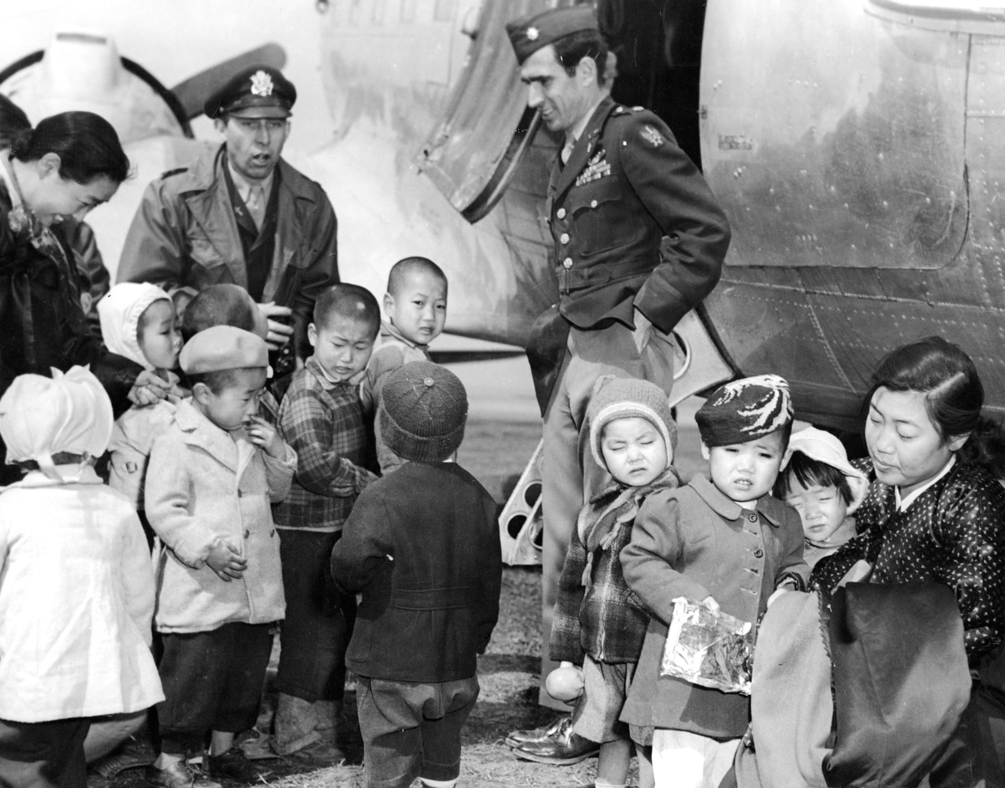 Chaplain Lt. Col. Russell Blaisdell (left) and Lt. Col. Dean Hess (right) on a return visit to Cheju-do. The children were now well-fed and clothed. (U.S. Air Force photo)