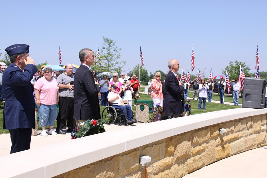 Col. Gordon H. Elwell, Jr., 911th Airlift Wing commander, and Congressman Tim Murphy pay respect to the flag during a 21-gun salute in honor of those who have given their life for the country at a Memorial Day ceremony held May 30 at the National Cemetery of the Alleghenies located in Washington County.