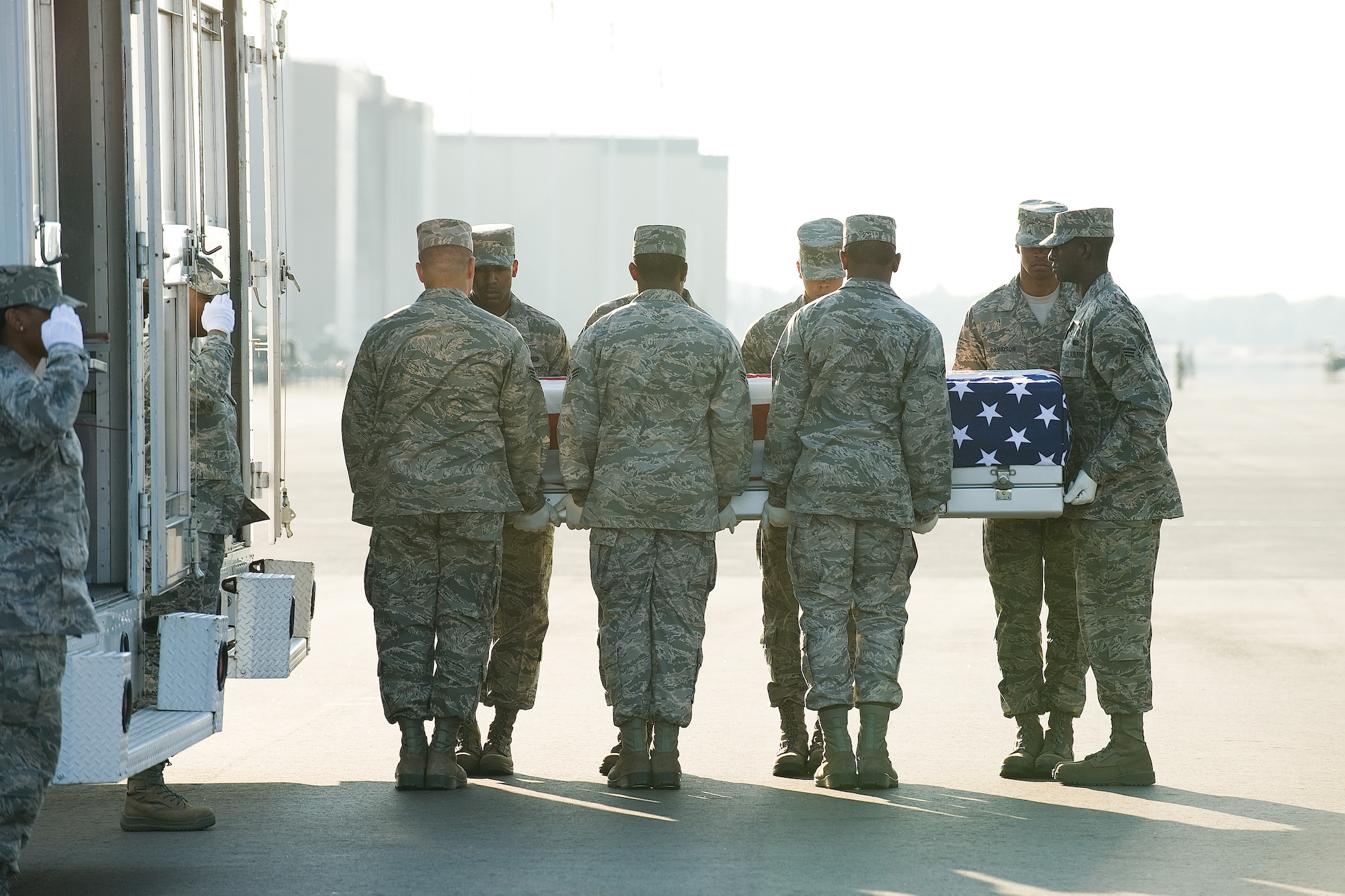 11 June 2010  USAF Photo by Jason Minto.  A U.S. Air Force carry team transfers the remains of Air Force SSgt David C. Smith of Eight Mile, AL, at Dover Air Force Base, Del., June 11, 2010.  
