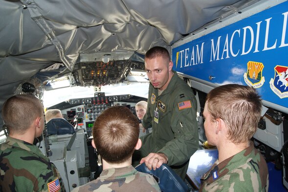 Capt. Brandon Gillet, 91st Air Refueling Squadron, answers questions from Civil Air Patrol cadets about the KC-135 Stratotanker during a tour at MacDil Air Foece Base, Fla. June 16, 2010. (U.S. Air Force Photo/Capt. Shane Huff)
