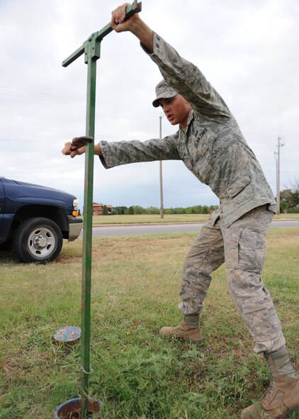 DYESS AIR FORCE BASE, Texas-- Airman 1st class Bryan Frees, 7th Civil Engineer Squadron water/fuels system maintenance journeyman, turns off a water valve so a fire hydrant can be replaced June 14 here. 7th CES supplies water to the entire base by continuously running water distribution systems and responding to any mishaps involving the base water system. 7th CES is also responsible for fuel distribution that supplies aircraft on the base. (U.S. Air Force photo/ Airmen 1st Class Brittney Smolinski)