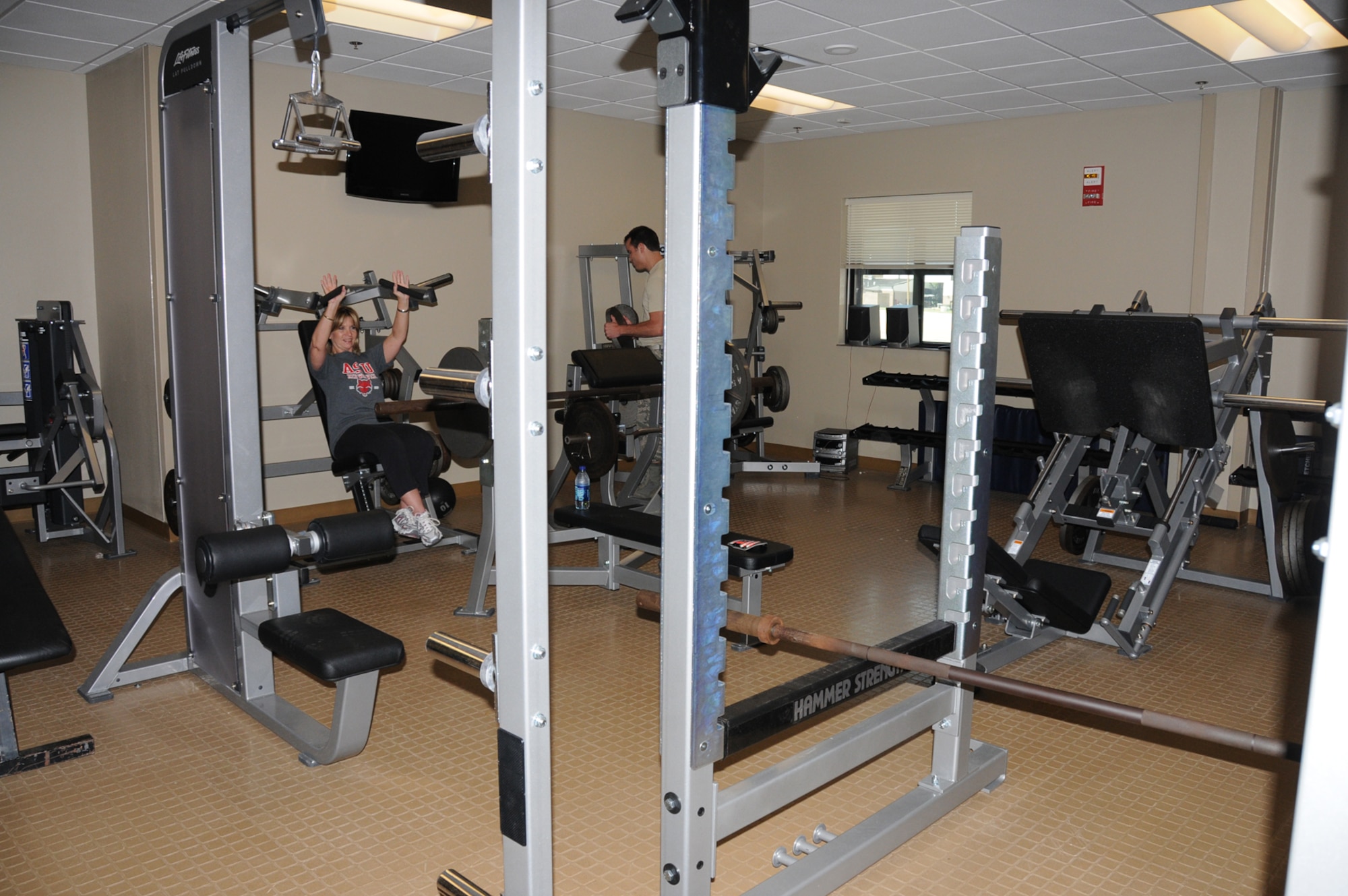 Information manager Patricia Oosterhuis works out on her lunch hour in the new Keesler Fire Emergency Services Facility.  A ribbon-cutting ceremony takes place at 3 p.m. Wednesday, preceded by tours starting at noon.  The 50,000-square-foot facility is built to withstand 150 mph winds.  It replaces a structure built in 1941 that was expanded 13 times and condemned after damage from Hurricane Katrina nearly five years ago.  (U.S. Air Force photo by Kemberly Groue)
