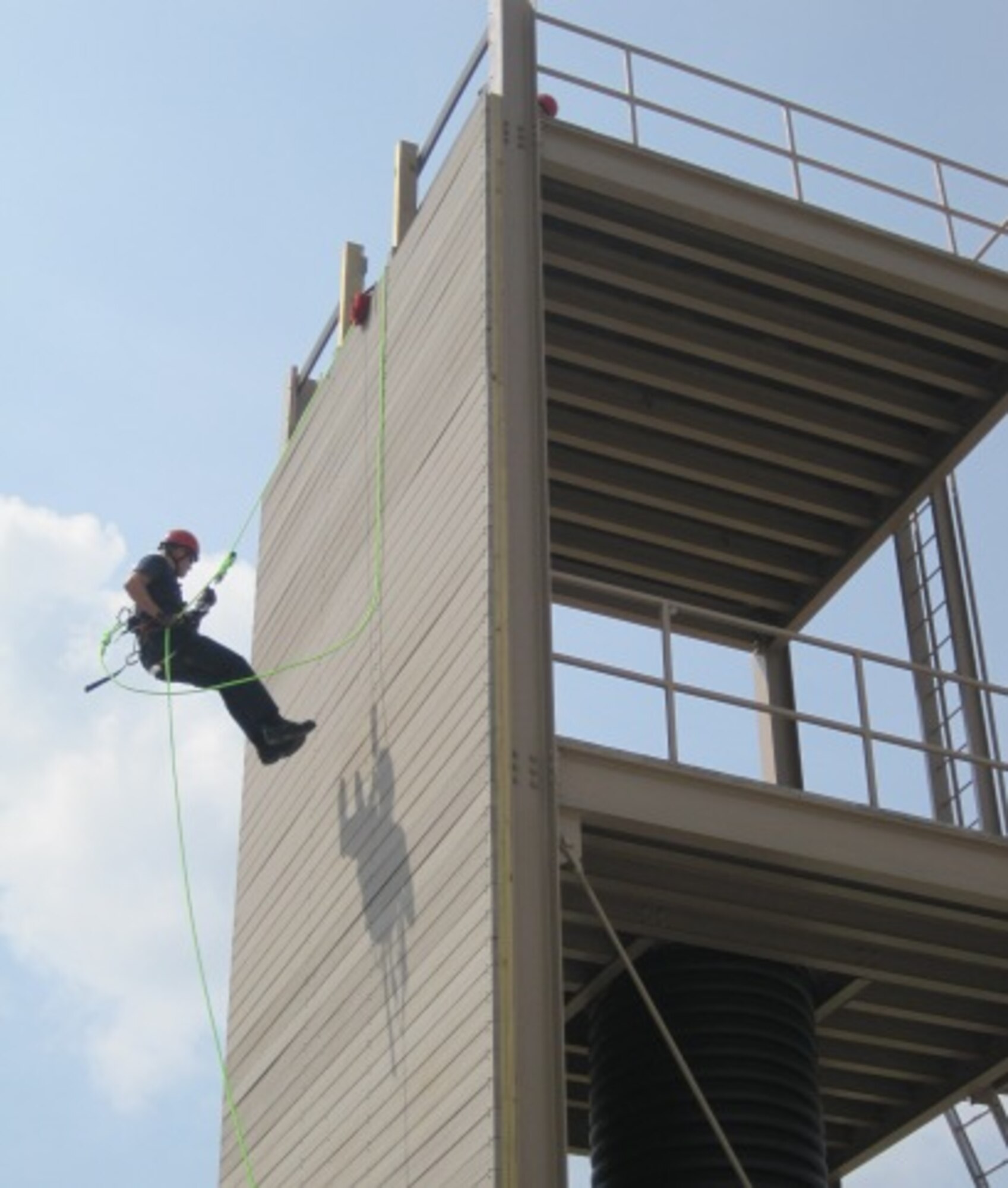 The new Technical Rescue Tower was tested by Dobbins Fire and Emergency Services.  James Butler, certified rescue technician, rappels down the wall of the tower.  (U.S. Air Force photo/Chris Howe)


