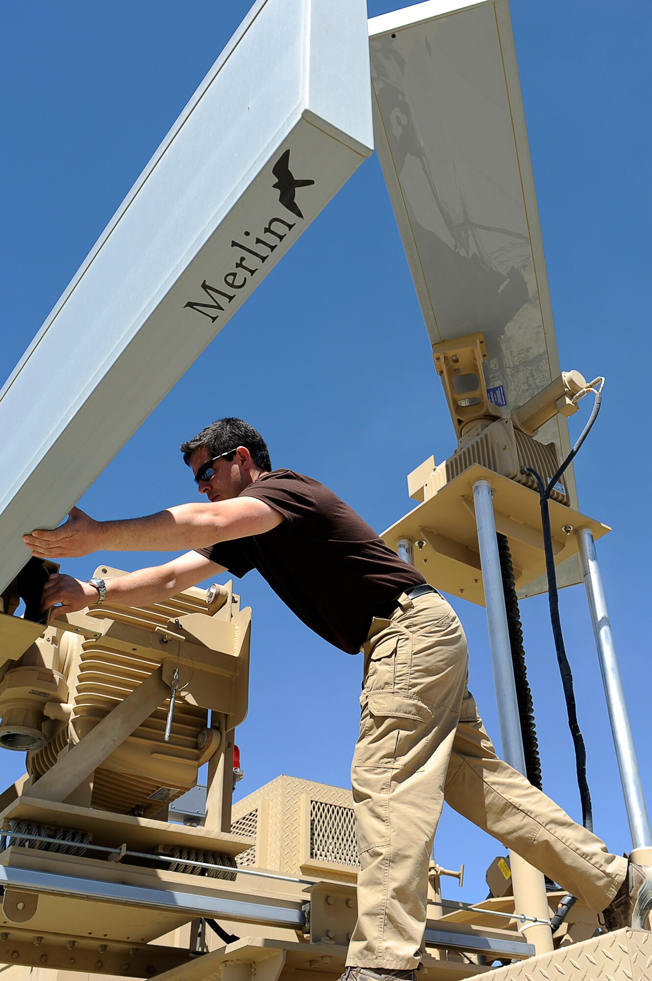 Mike Bierman installs a Merlin bird radar system May 29, 2010, at Bagram Airfield, Afghanistan. Mr. Bierman is a contractor with DeTech Incorporated. (U.S. Air Force photo/Master Sgt. Jeromy K. Cross)








