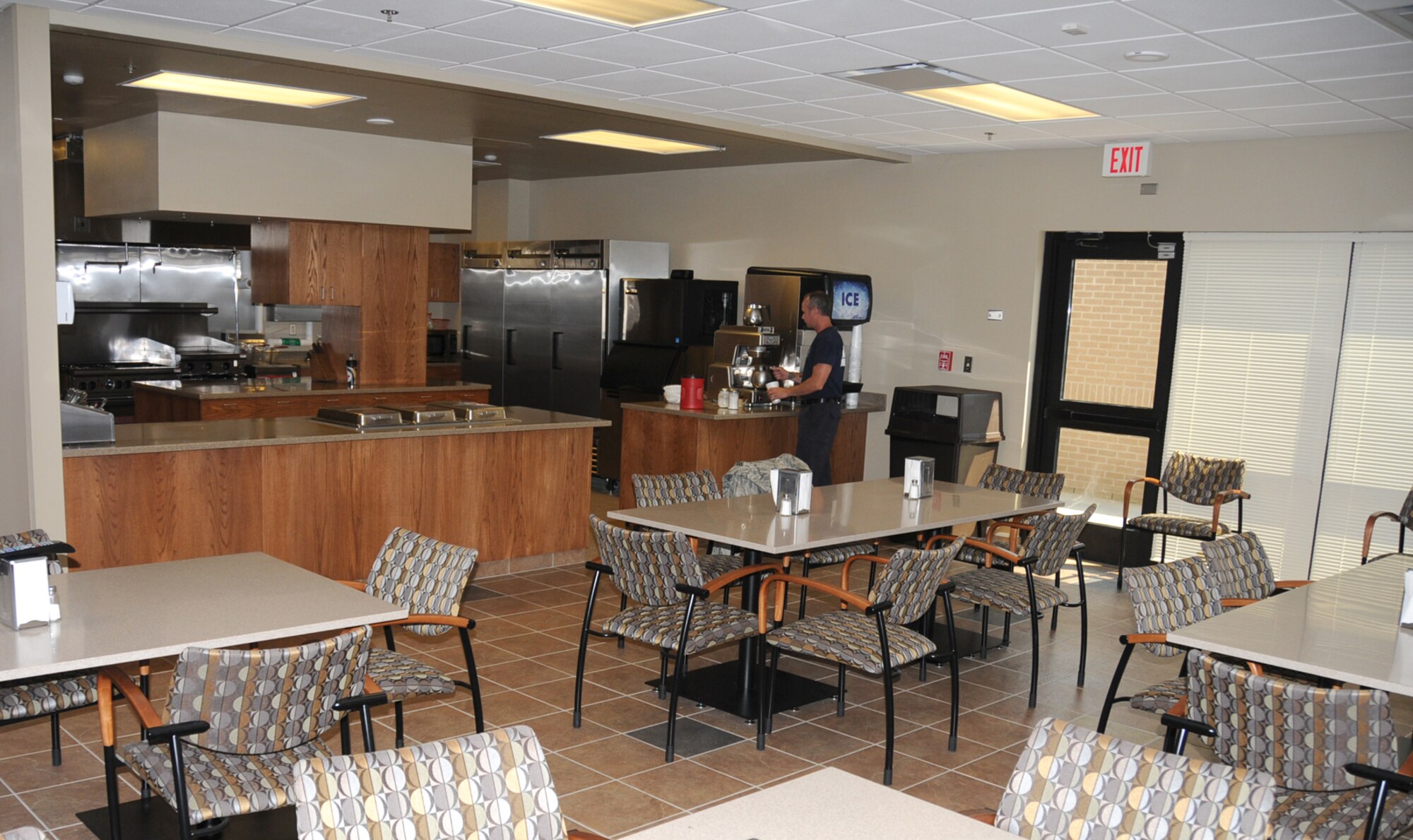 Firefighter Troy Smith fixes a cup of coffee in the kitchen of the new Keesler Fire Emergency Services Facility.  A ribbon-cutting ceremony takes place at 3 p.m. Wednesday, preceded by tours starting at noon.  The 50,000-square-foot facility is built to withstand 150 mph winds.  It replaces a structure built in 1941 that was expanded 13 times and condemned after damage from Hurricane Katrina nearly five years ago.  (U.S. Air Force photo by Kemberly Groue)
