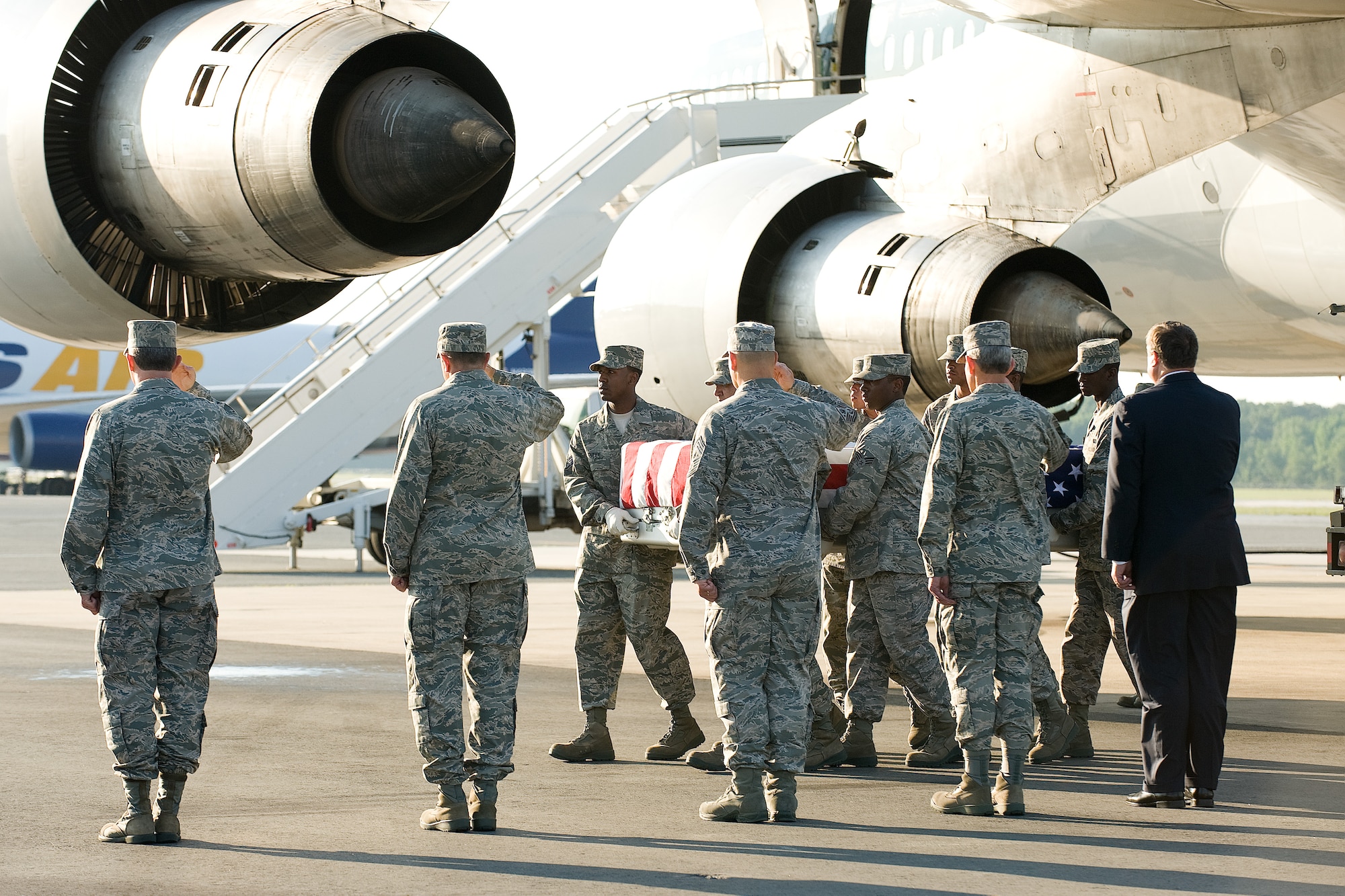 11 June 2010  USAF Photo by Jason Minto.  A U.S. Air Force carry team transfers the remains of Air Force SSgt Michael P. Flores of San Antonio, TX, at Dover Air Force Base, Del., June 11, 2010.  