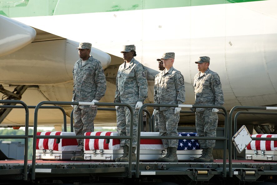 11 June 2010  USAF Photo by Jason Minto.  A U.S. Air Force carry team transfers the remains of Air Force SSgt Michael P. Flores of San Antonio, TX, at Dover Air Force Base, Del., June 11, 2010.  