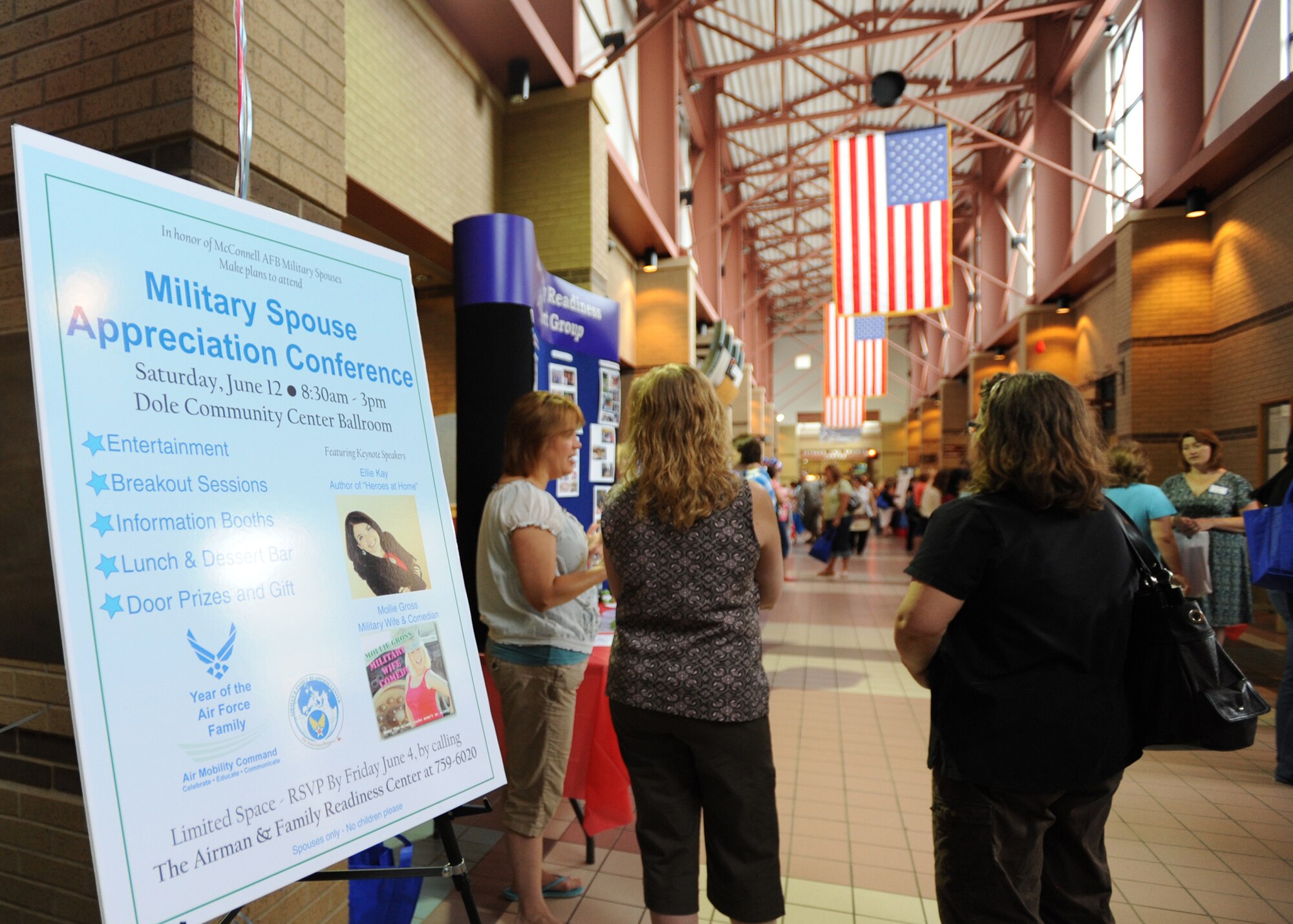 Team McConnnell military spouses gather during a military spouse appreciation conference held at the Robert J. Dole Community Center, June 12, 2010, McConnell Air Force Base, Kan.  The event included entertainment, informational booths, lunch and door prizes.  The conference, sponsored by the Airman Family and Readiness Center, was held for the spouses all of active-duty, Reserve, Guard and servicemembers.   (U.S. Air Force photo/Airman 1st Class Andrea Salazar)