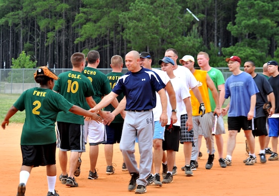 100615-F-4406D-001 SHAW AIR FORCE BASE, S.C.--   After the summer intramural softball game between the 20th Communications squadron and the 20th Component Maintenance squadron, both teams line up to congratulate one another for a good game at the outdoor sports complex baseball field June 15, 2010. The 20th CMS2 won the game. Beginning in May, each softball team plays about 16 to 20 games during the softball season. (U.S. Air Force photo/ Airman 1st Class Tabatha L. Duarte)
