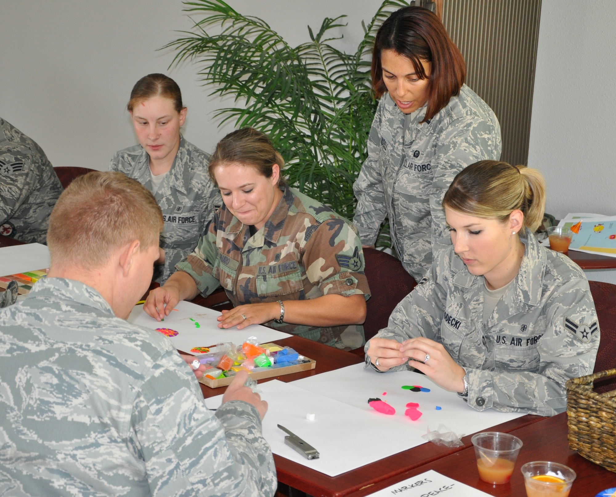 LAUGHLIN AIR FORCE BASE, Texas – A group of Laughlin Airmen participate in an art therapy demonstration during an event sponsored by the ADAPT program here June 9. ADAPT is an Air Force program that provides treatment and prevention of addictions to alcohol and drugs by providing counseling and education to the Air Force community. (U.S. Air Force photo by Airman 1st Class Blake Mize)
